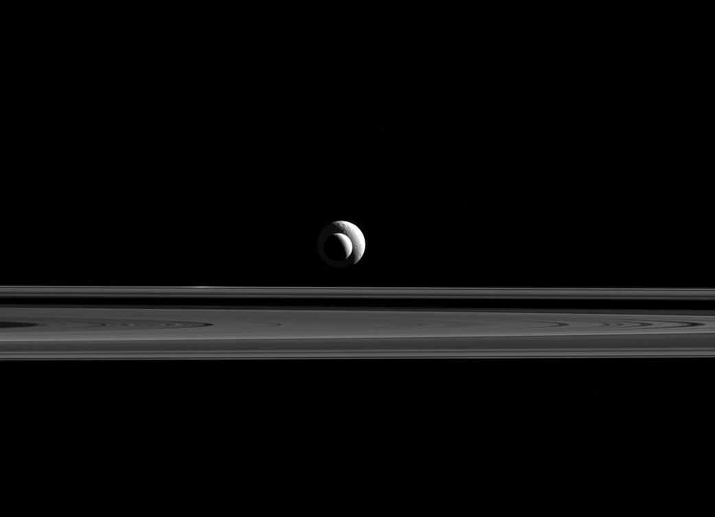 Enceladus and Tethys line up almost perfectly for Cassini's cameras.  The image was taken in red light with the Cassini spacecraft narrow-angle camera on Sept. 24, 2015. (NASA/JPL-Caltech/Space Science Institute)