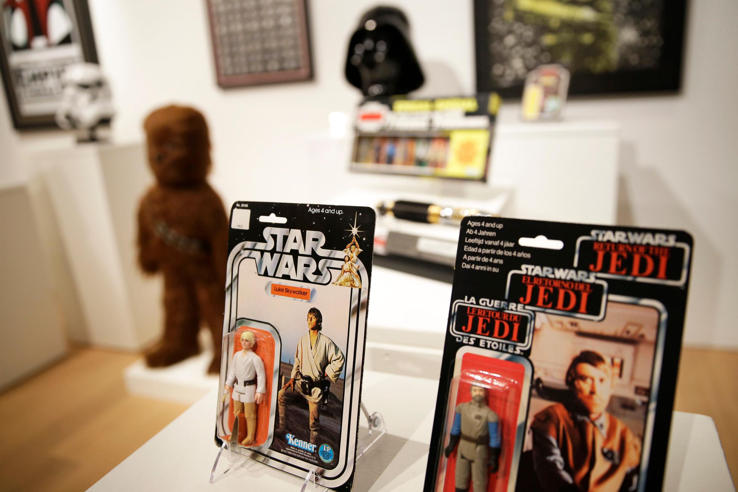 Toys and other memorabilia from Star Wars are displayed at Sotheby's in New York City on Dec. 2, 2015.