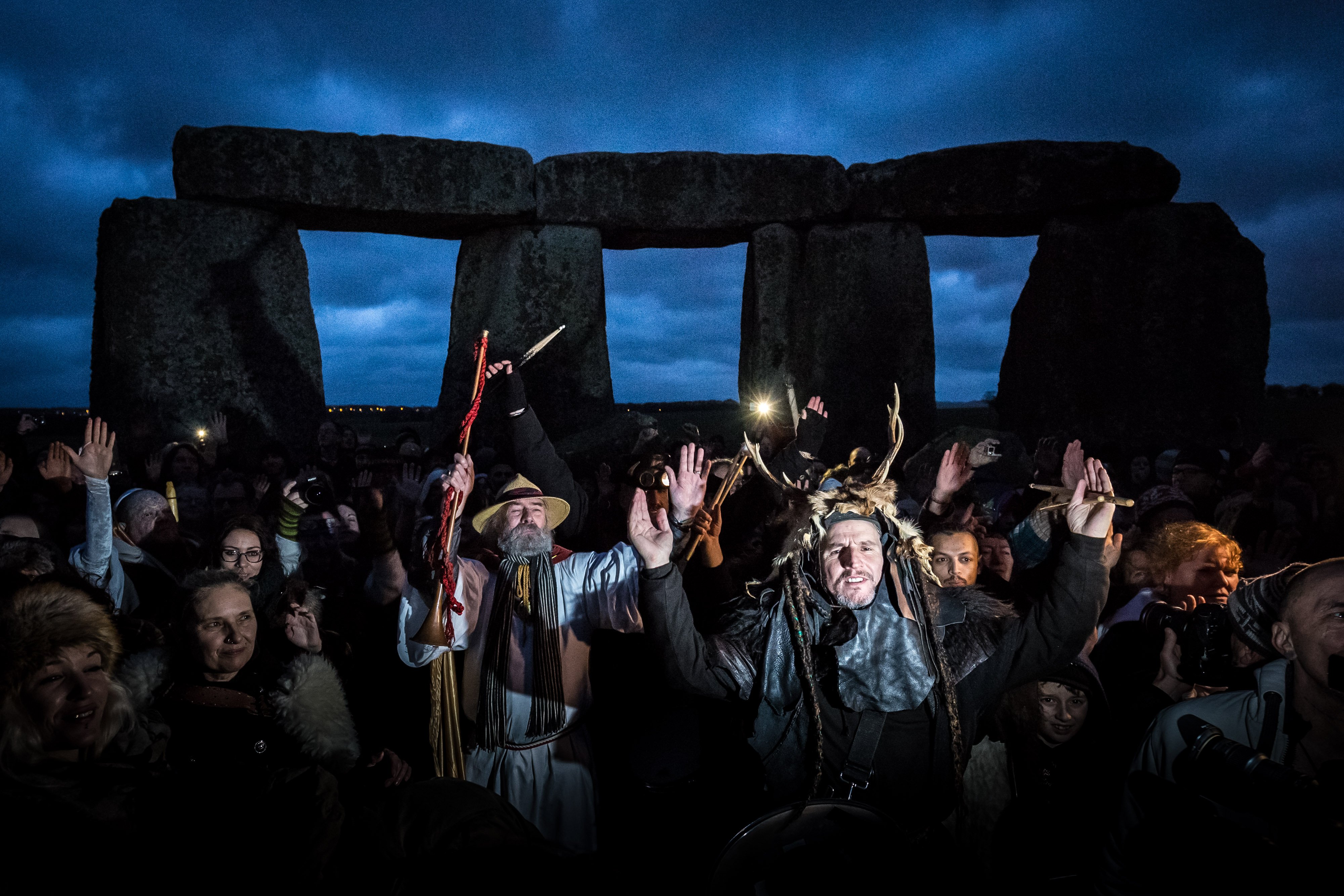 Revelers gather near the ancient stones at Stonehenge on Salisbury Plain, UK to celebrate the first day of winter, on Dec. 22, 2015.