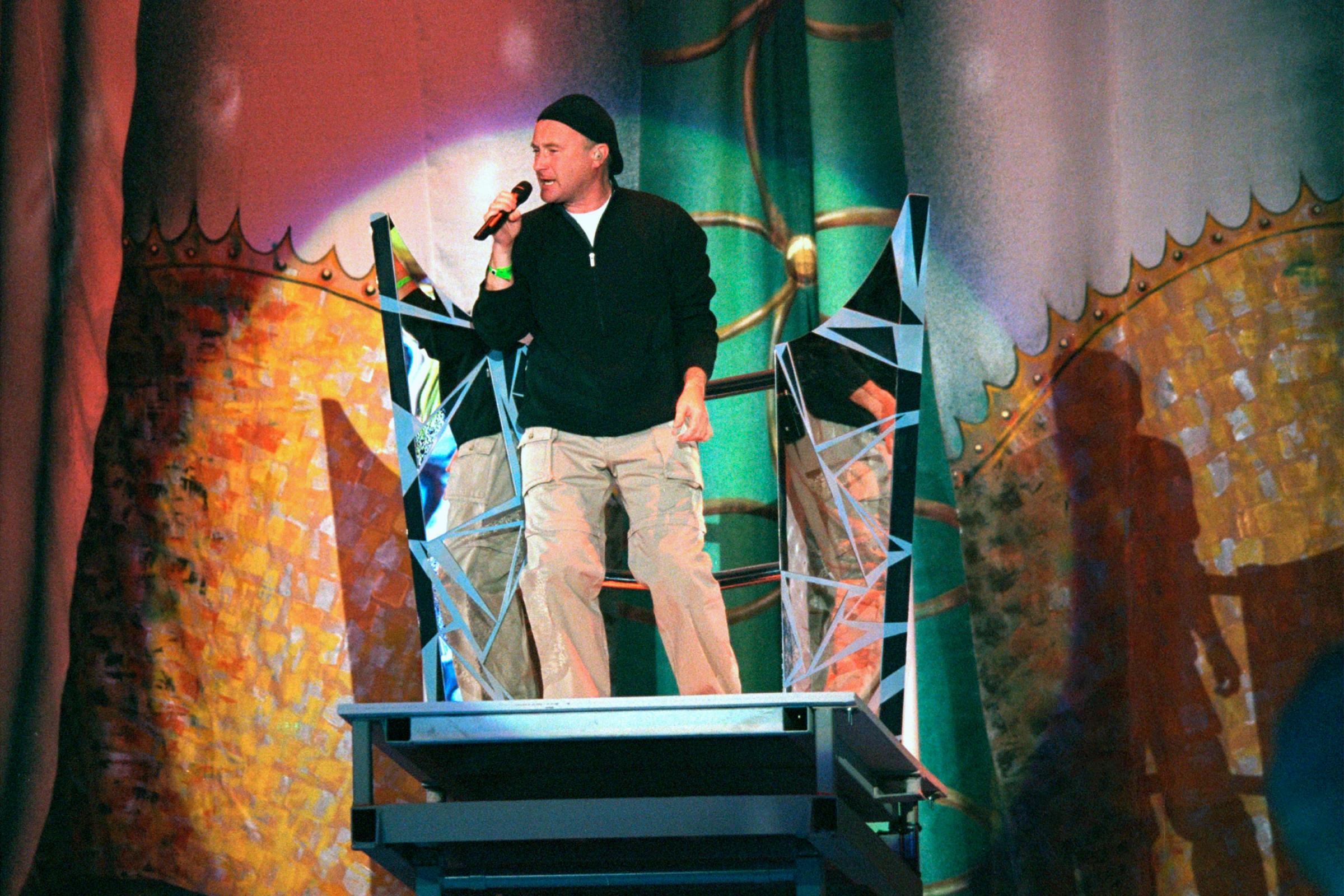 Phil Collins performs during Super Bowl XXXIV in Atlanta on Jan. 30, 2000.