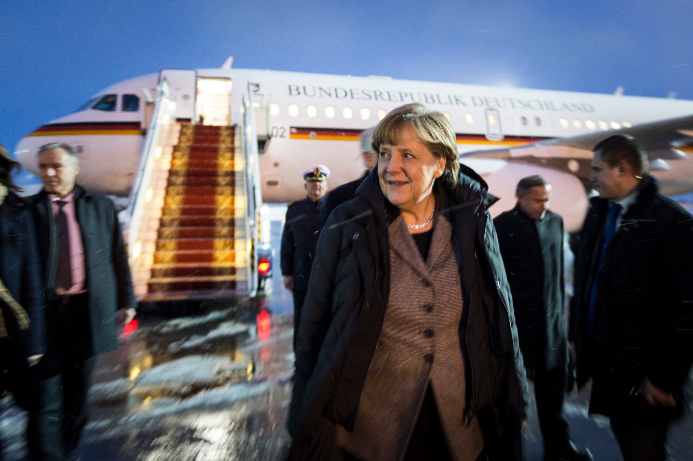Chancellor Angela Merkel leaves the plane at the airport of Kiev, after arriving for another round of negotiations with the presidents of France, Ukraine and Russia to settle the conflict in Ukraine. Feb. 5, 2015.ellor Angela Merkel leaves the plane at the airport of Kiev, after arriving for another round of negotiations with the presidents of France, Ukraine and Russia to settle the conflict in Ukraine. Feb. 5, 2015. MerkelRR