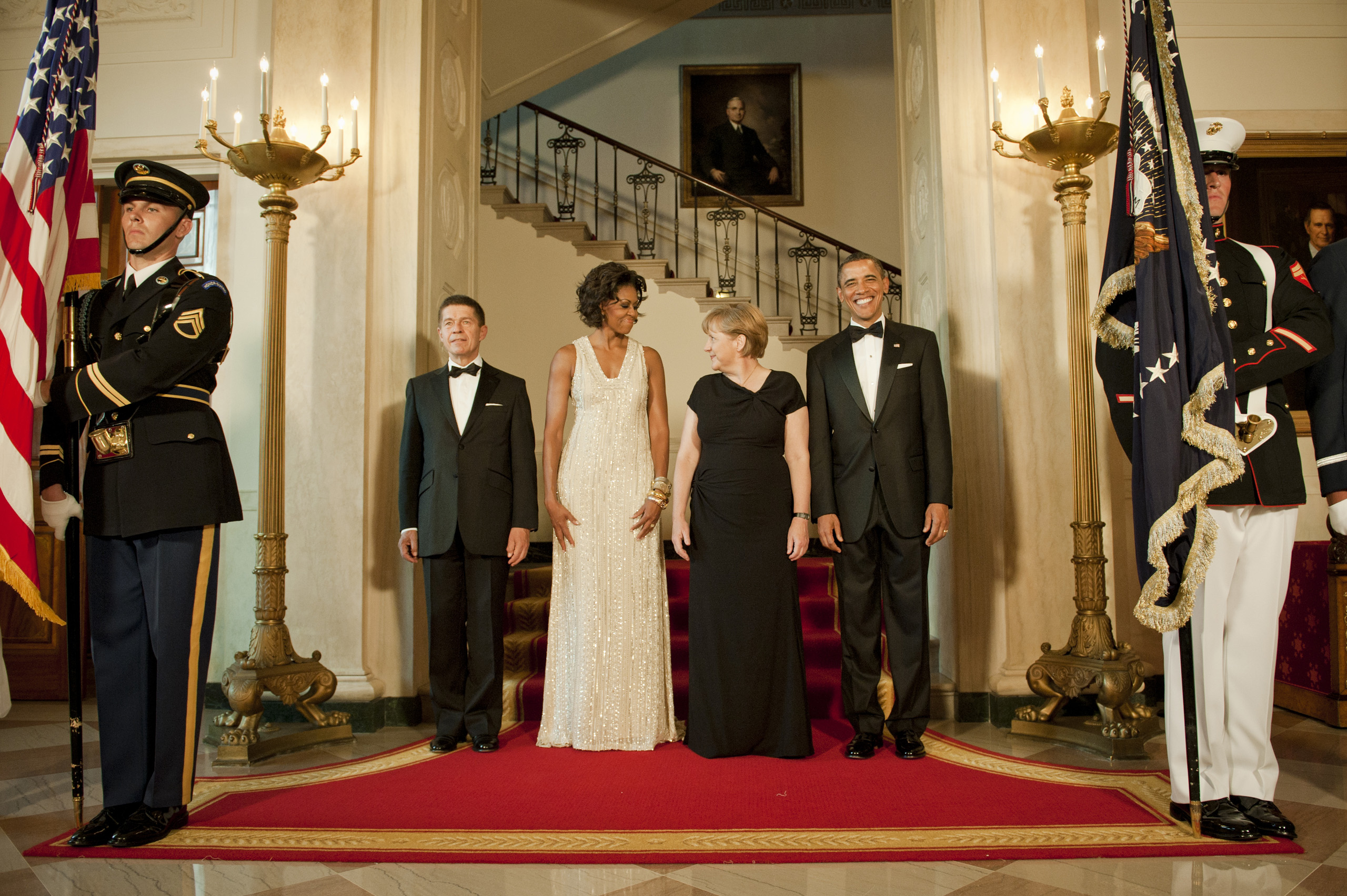 Angela Merkel, her husband Joachim Sauer and Michelle and Barrack Obama on their way to dinner in the White House's Rose garden. June 8, 2011.