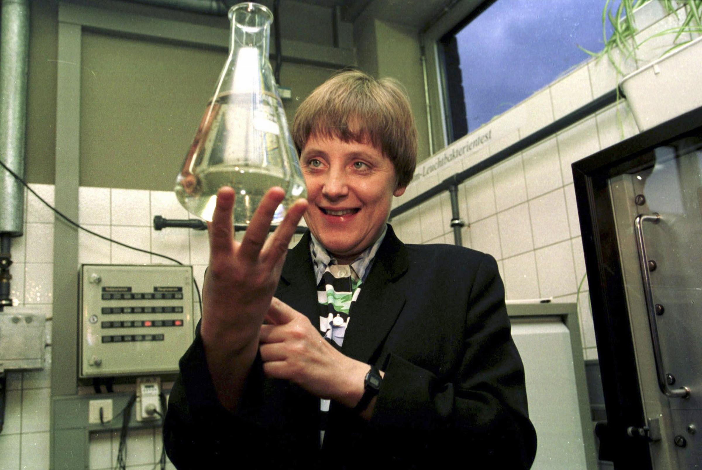 Former Federal Minister Merkel is holding up a test tube filled with water in water-control-station of Bad Honnef on Jan. 12, 1995.