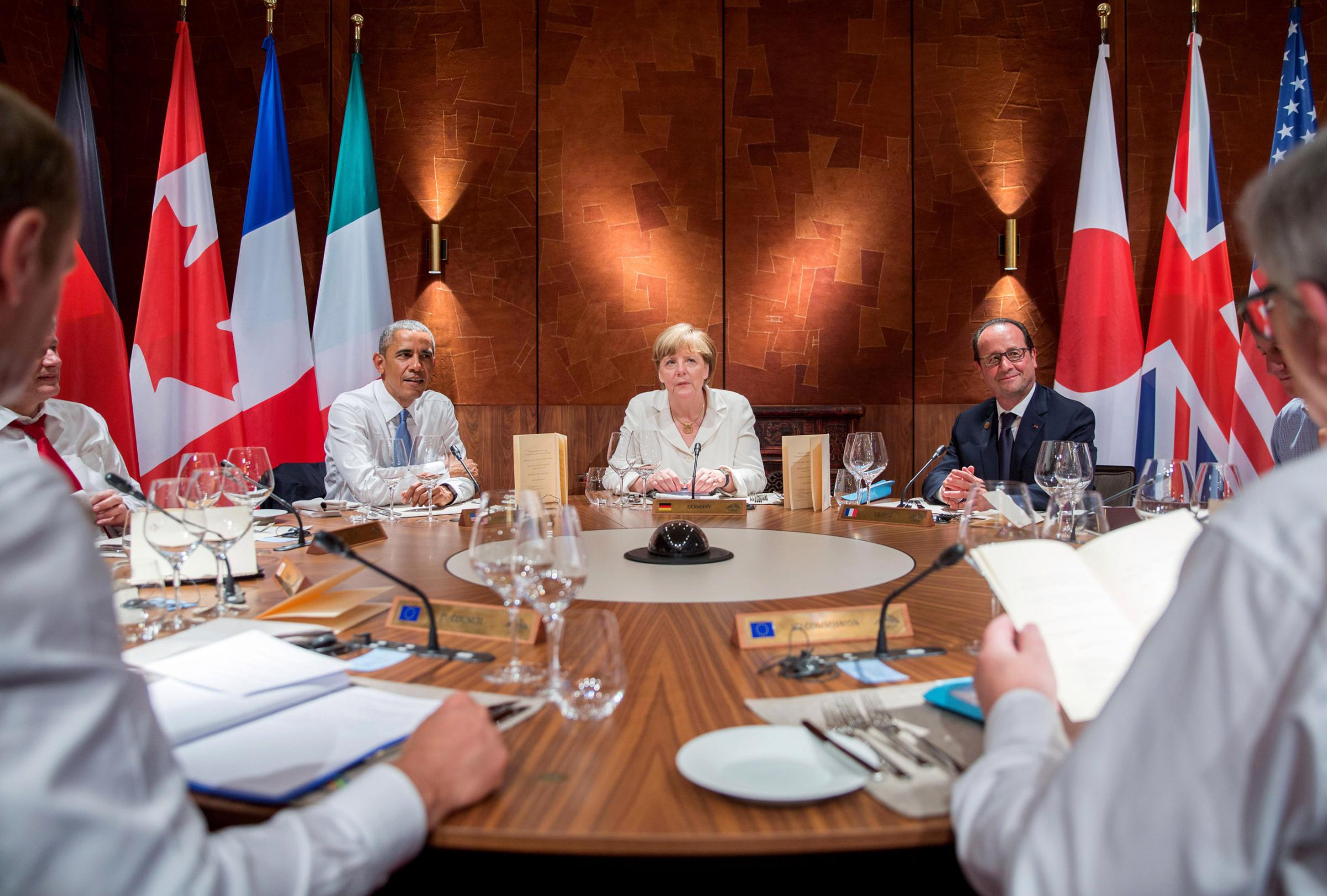 U.S. President Obama, Germany's Chancellor Merkel and France's President Hollande attend a working dinner at a G7 summit at the hotel castle Elmau in Kruen