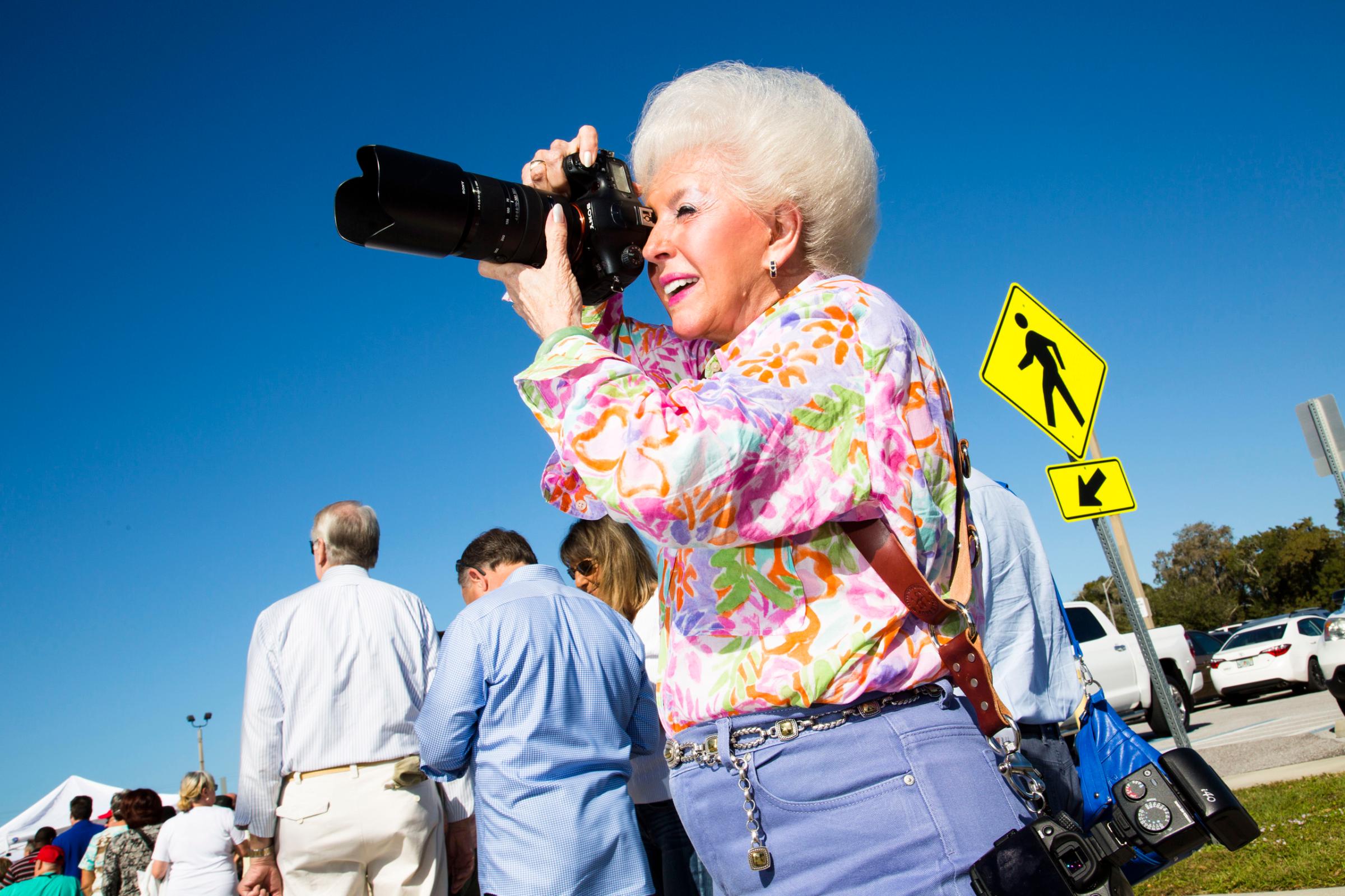 Supporter of Republican presidential candidate Donald Trump photographs at a Donald Trump rally in Sarasota, Fla. Nov. 28, 2015.