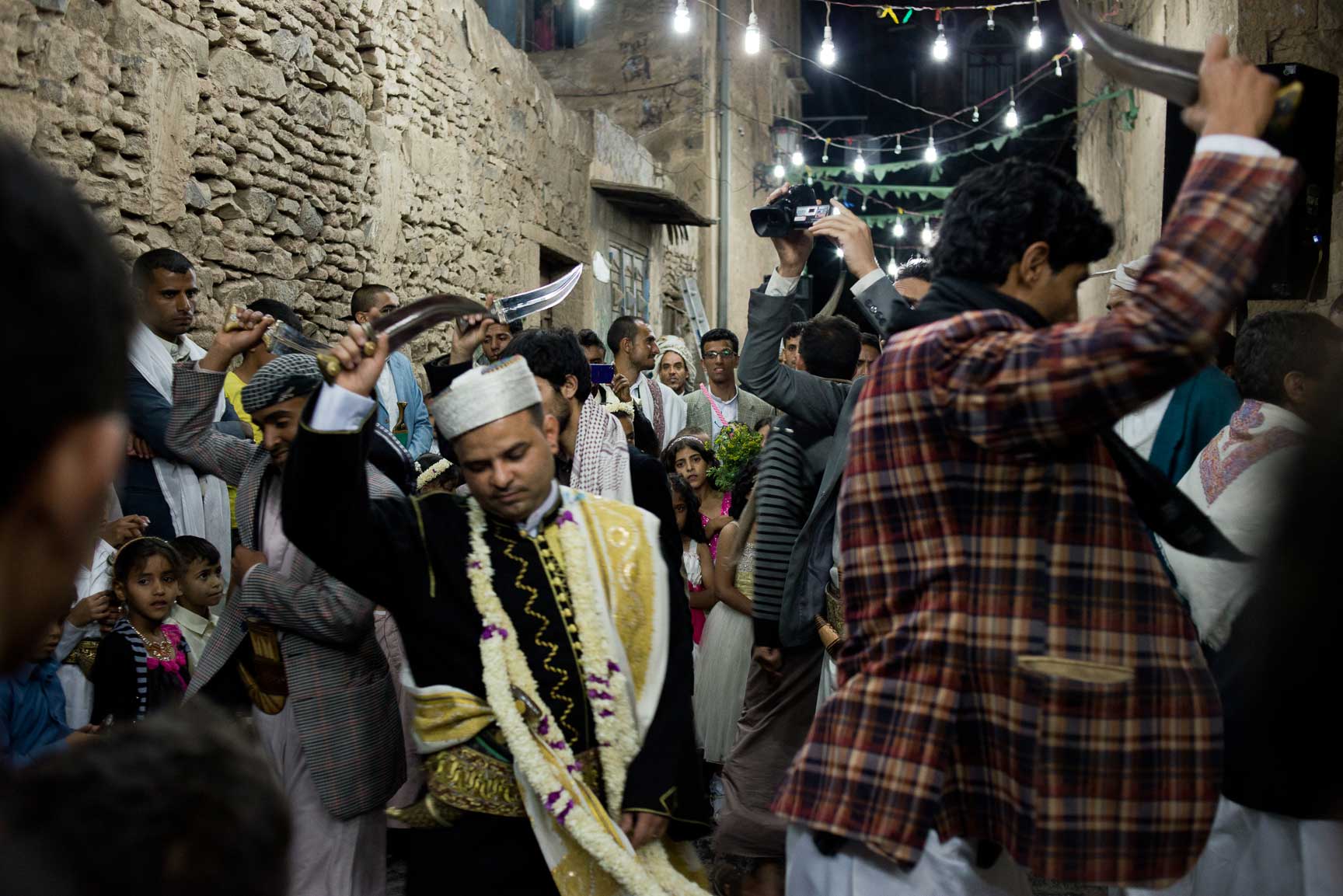 Yemeni men dance the bara'a, a traditional tribal dance of northern Yemen for a wedding celebration on June 4, 2015 in Sana'a, Yemen.