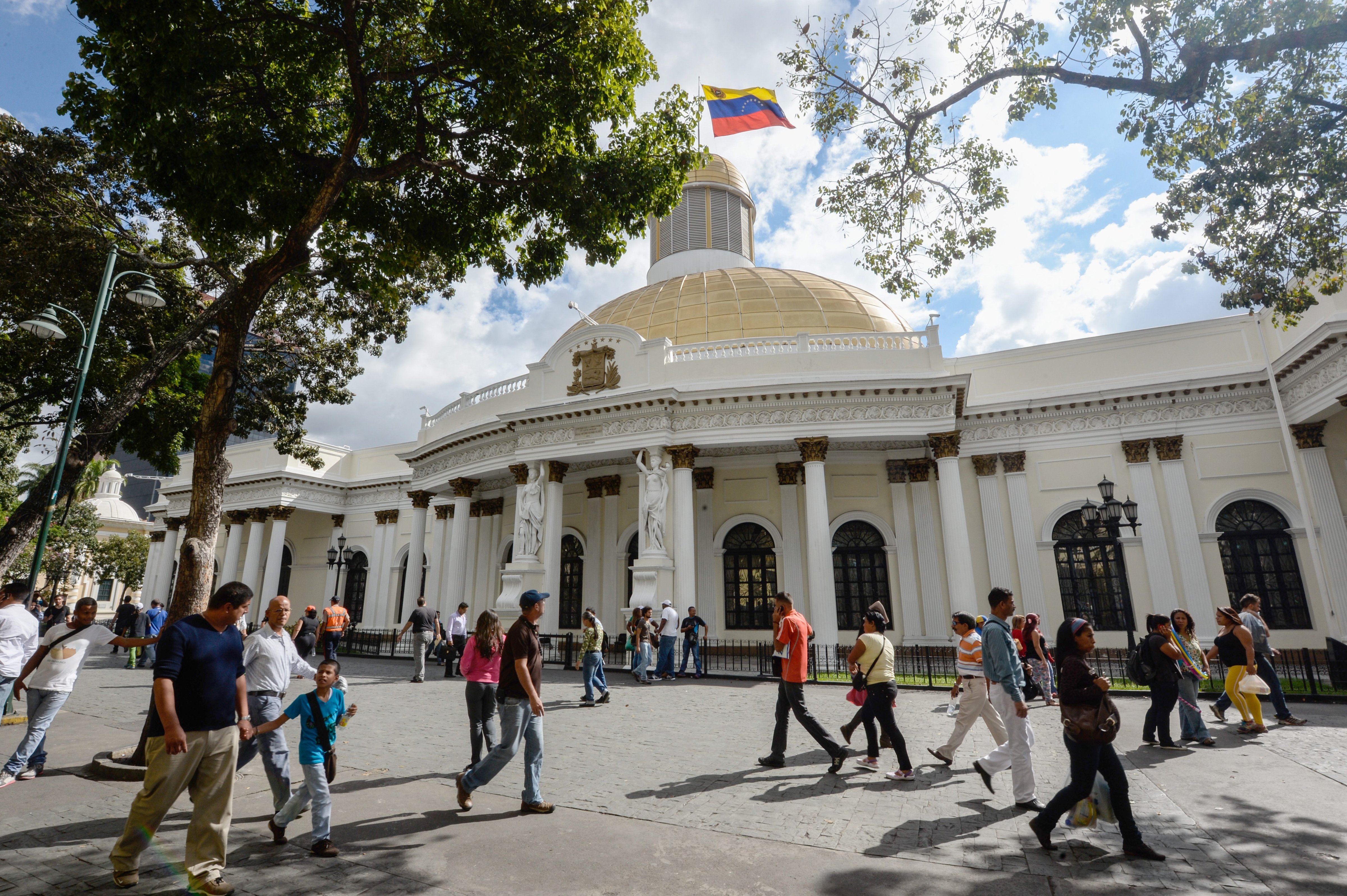 People pass by the National Assembly building in Caracas on Dec. 10, 2015. (Federico Parra—AFP/Getty Images)