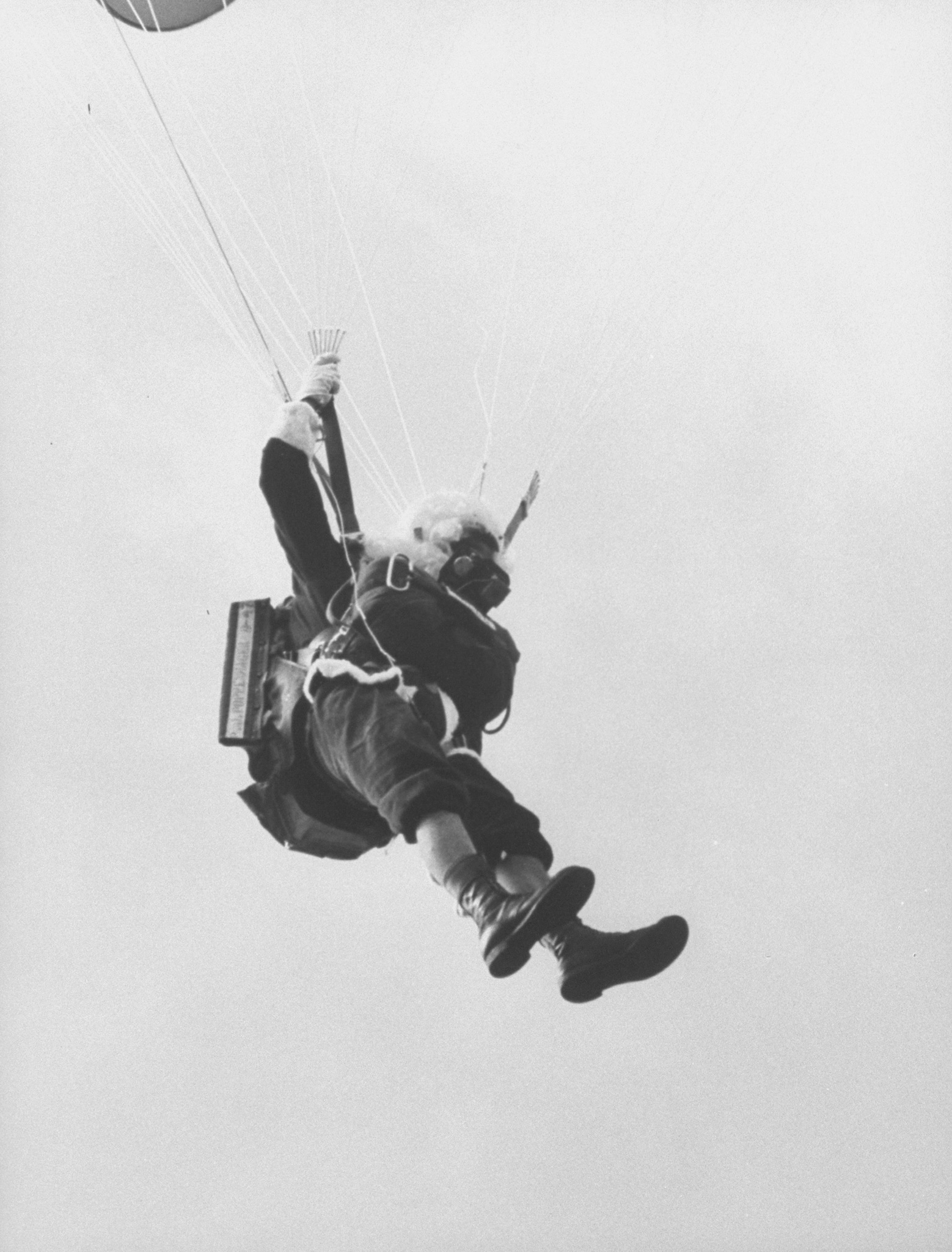 Santa Claus parachuting into Carol City Shopping Center. Florida, 1962.