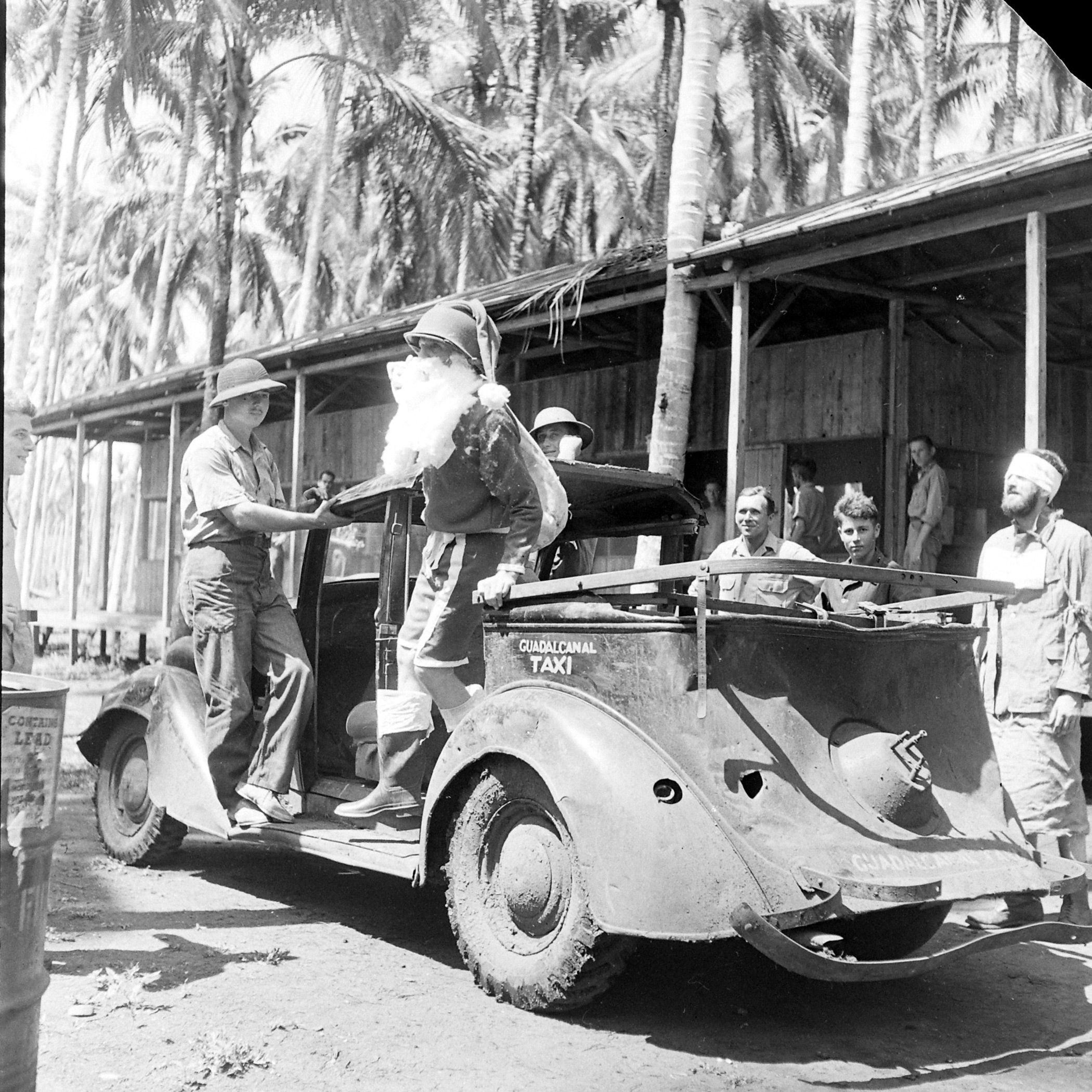 Santa arrives to entertain Allied troops on Christmas on Guadalcanal. Solomon Islands, 1960.