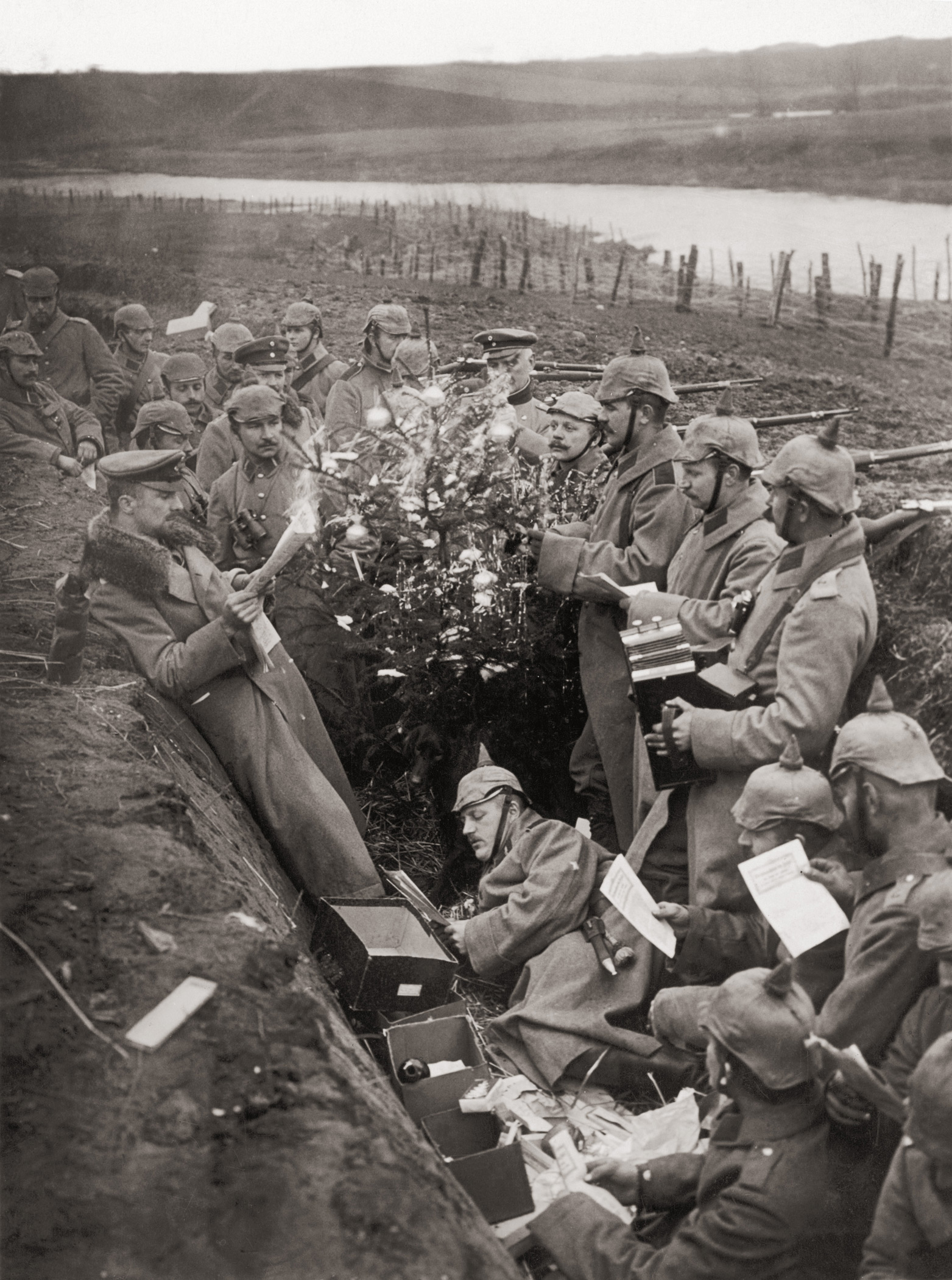 German troops singing around a Christmas tree in their trench on the Eastern Front during World War I.