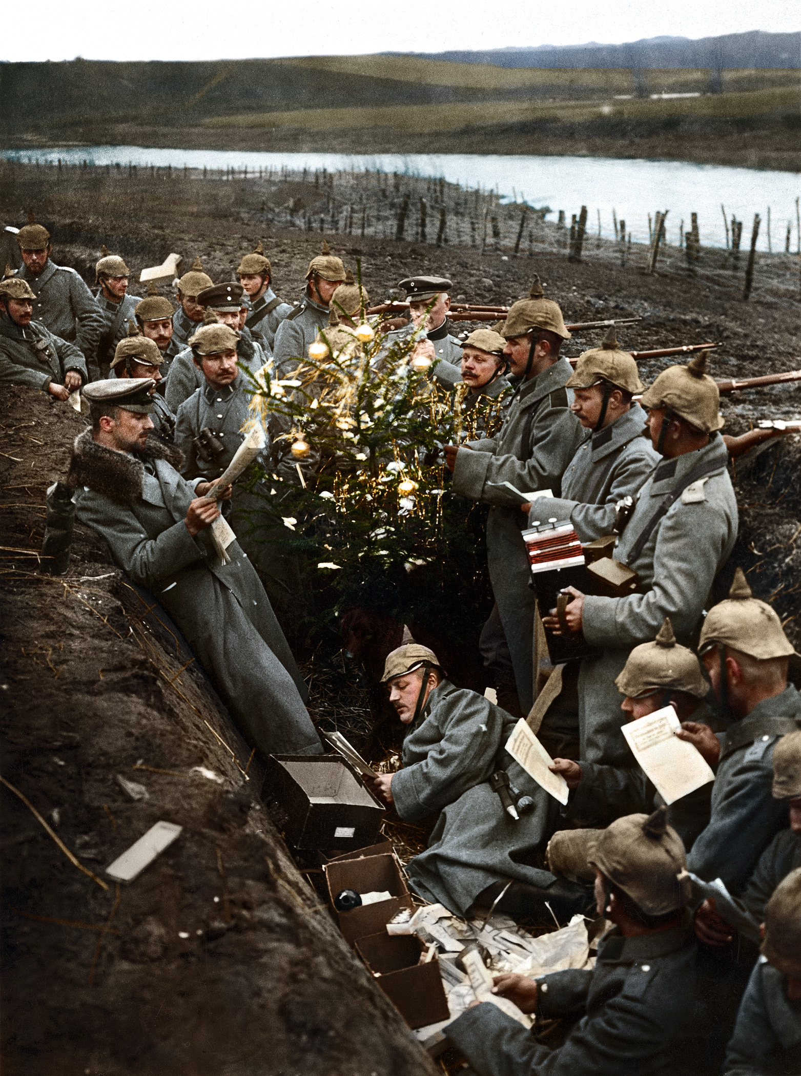 German troops singing around a Christmas tree in their trench on the Eastern Front during World War I.
