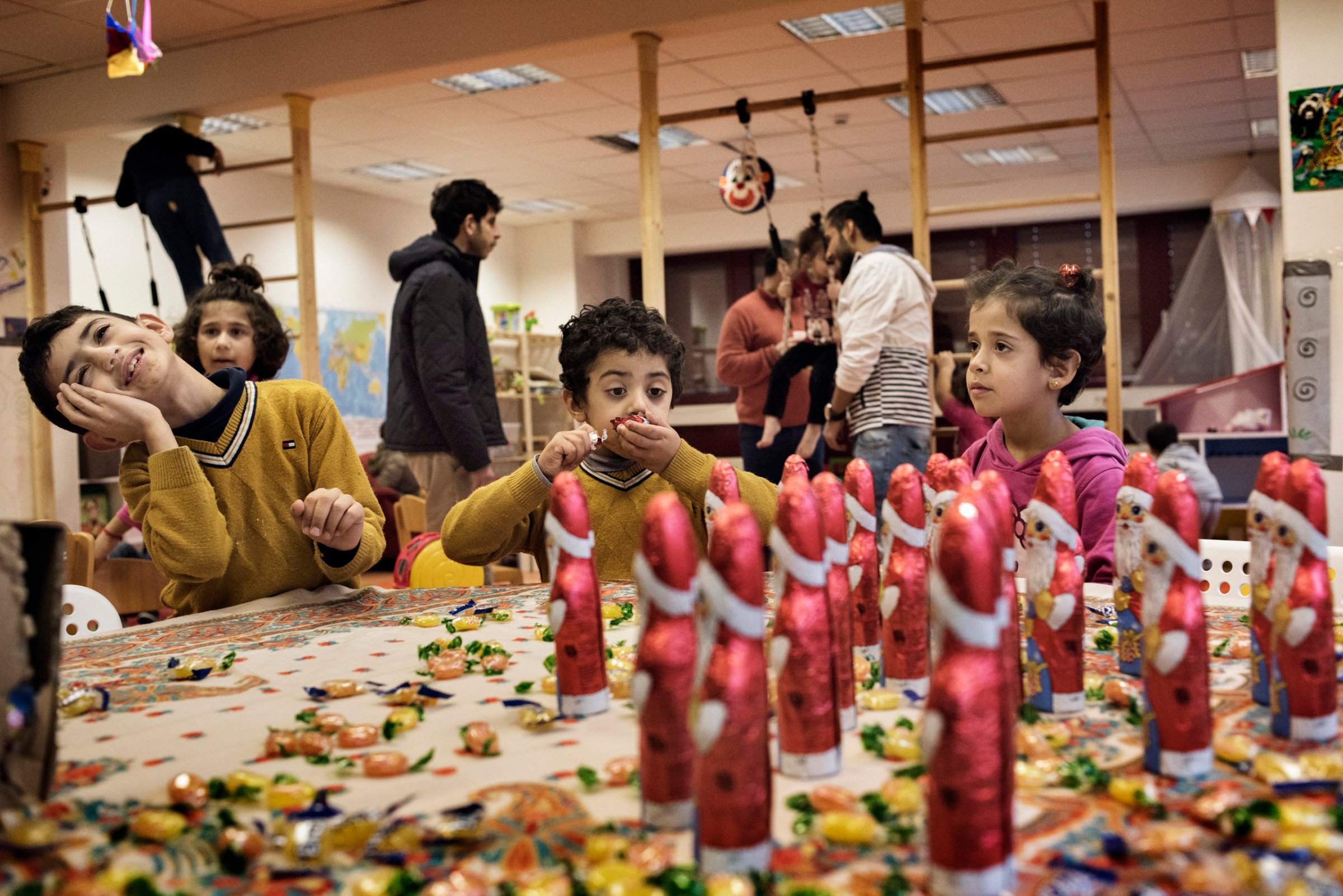 Children of refugees and asylum seekers at the kindergarden of the emergency shelter at a former administrative building in the district of Marzahn, one of many shelters in Berlin run by People's Solidarity. Berlin, Germany, Dec. 2015.