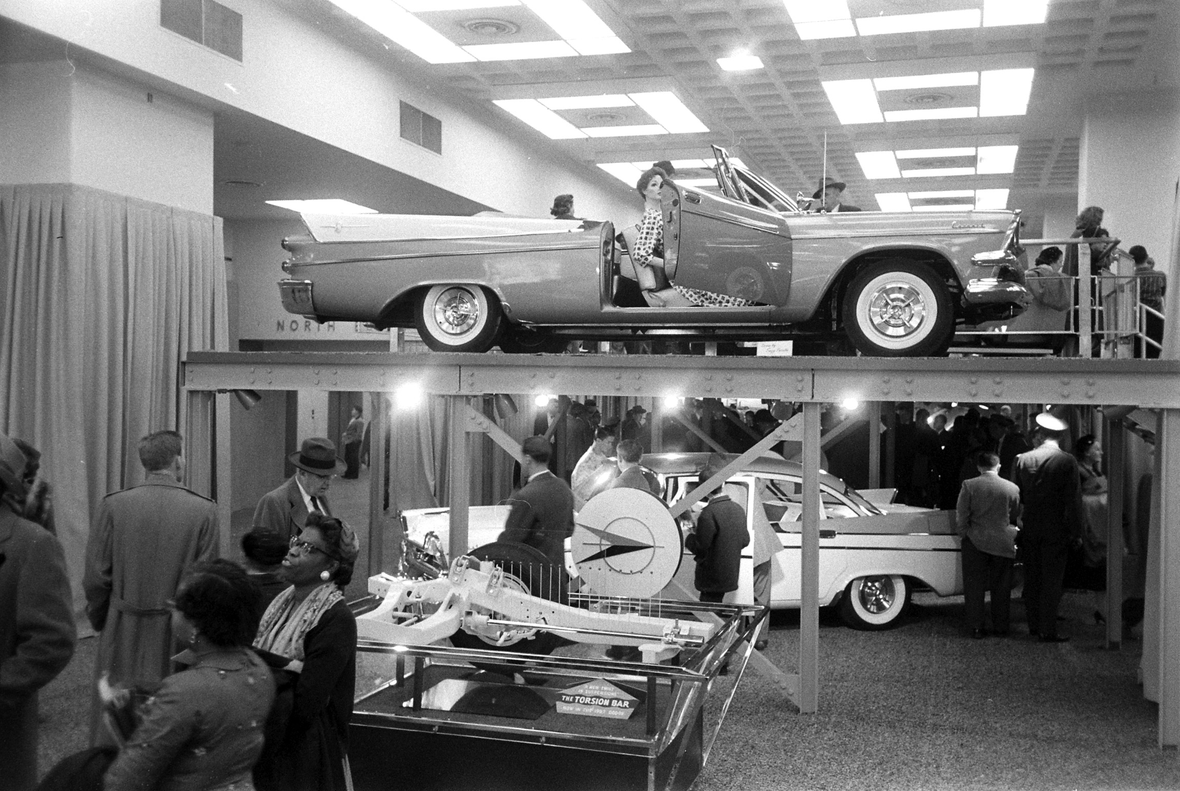 National Automobile Show at the New York Coliseum featuring 1957 lines.