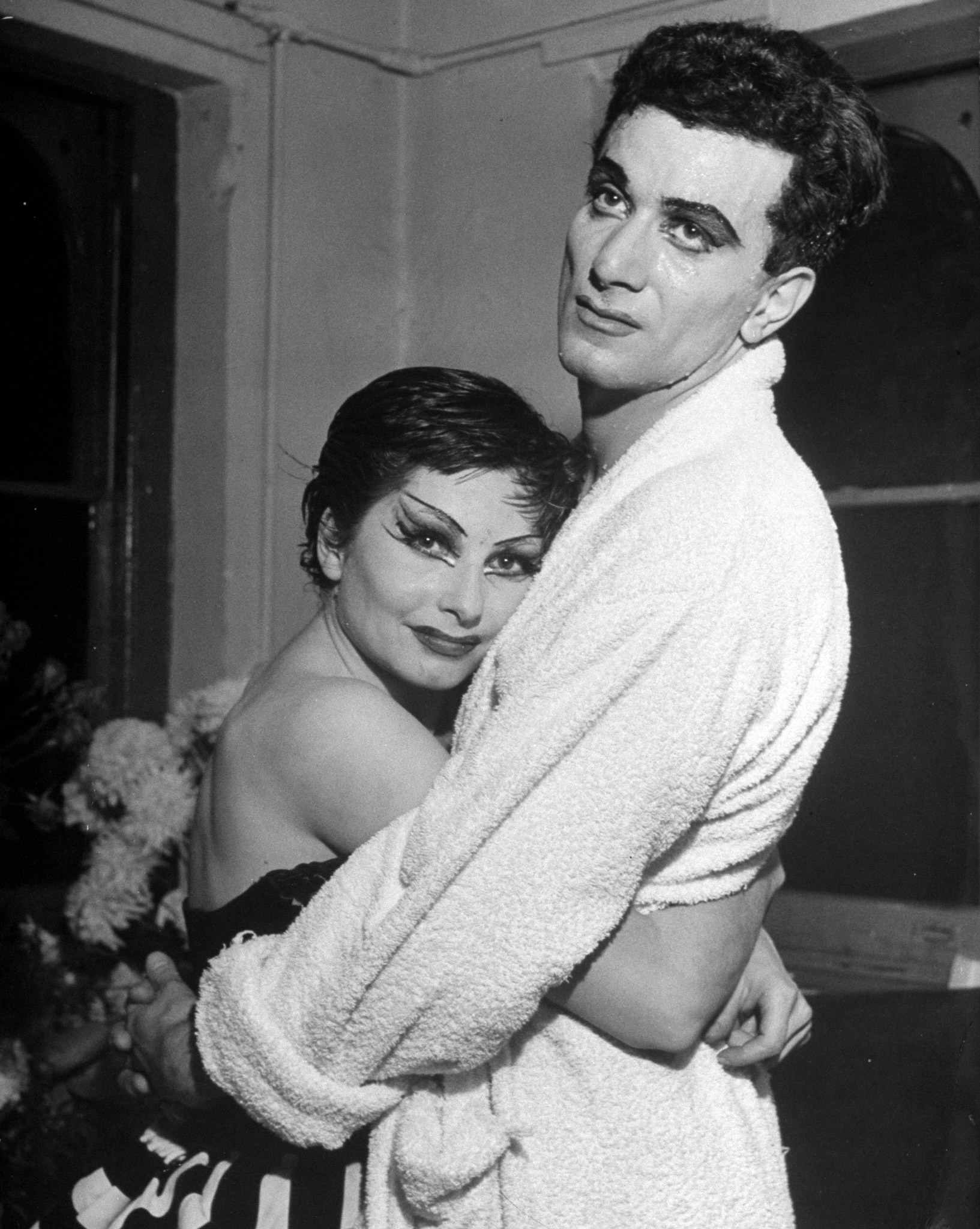 Dancers Roland Petit and Renee (Zizi) Jeanmaire hugging each other after performance in the ballet "Carmen," 1949.