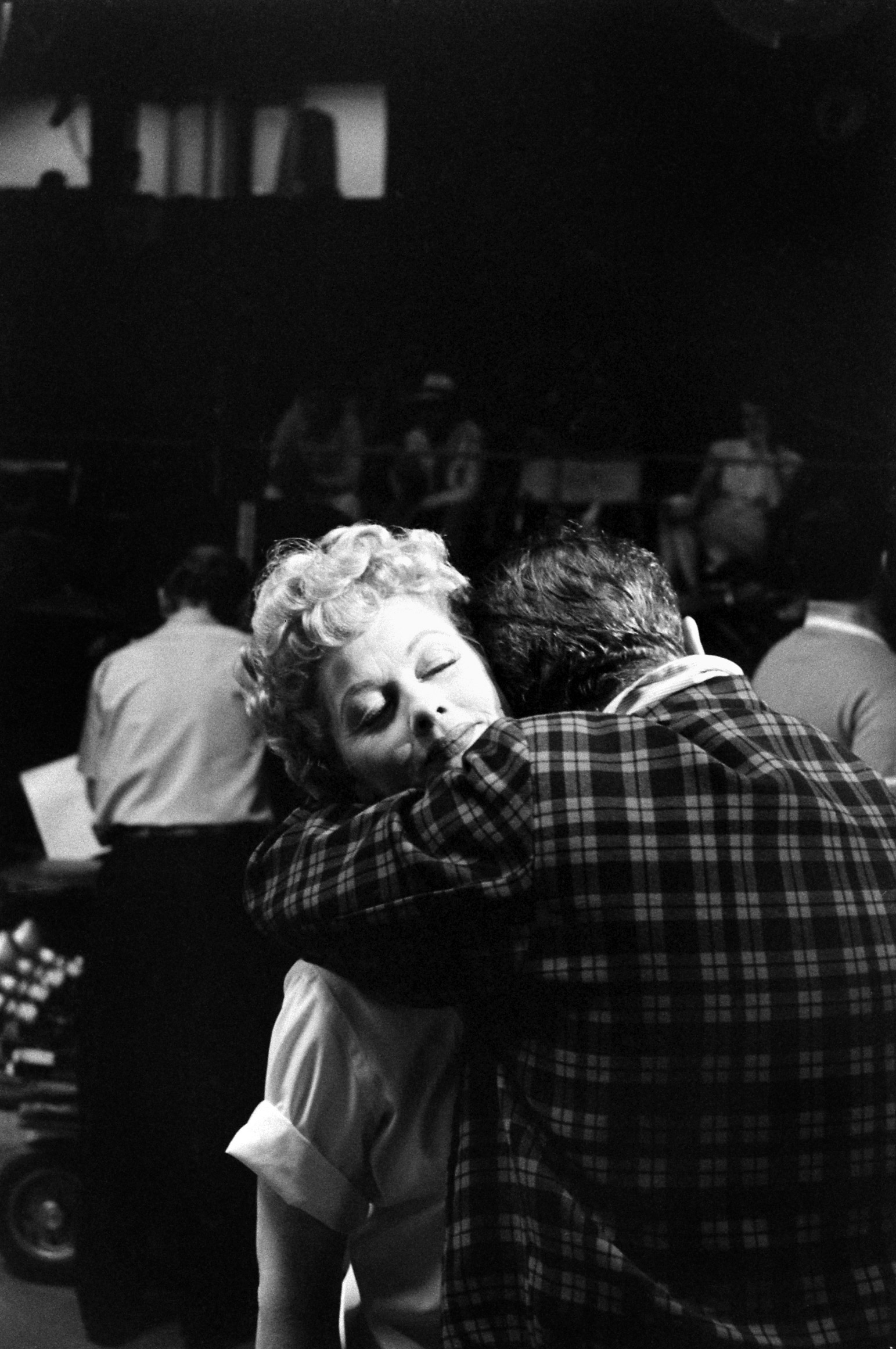 Desi Arnaz embraces Lucille Ball at the new home of their TV production empire, Desilu Studios, 1958.