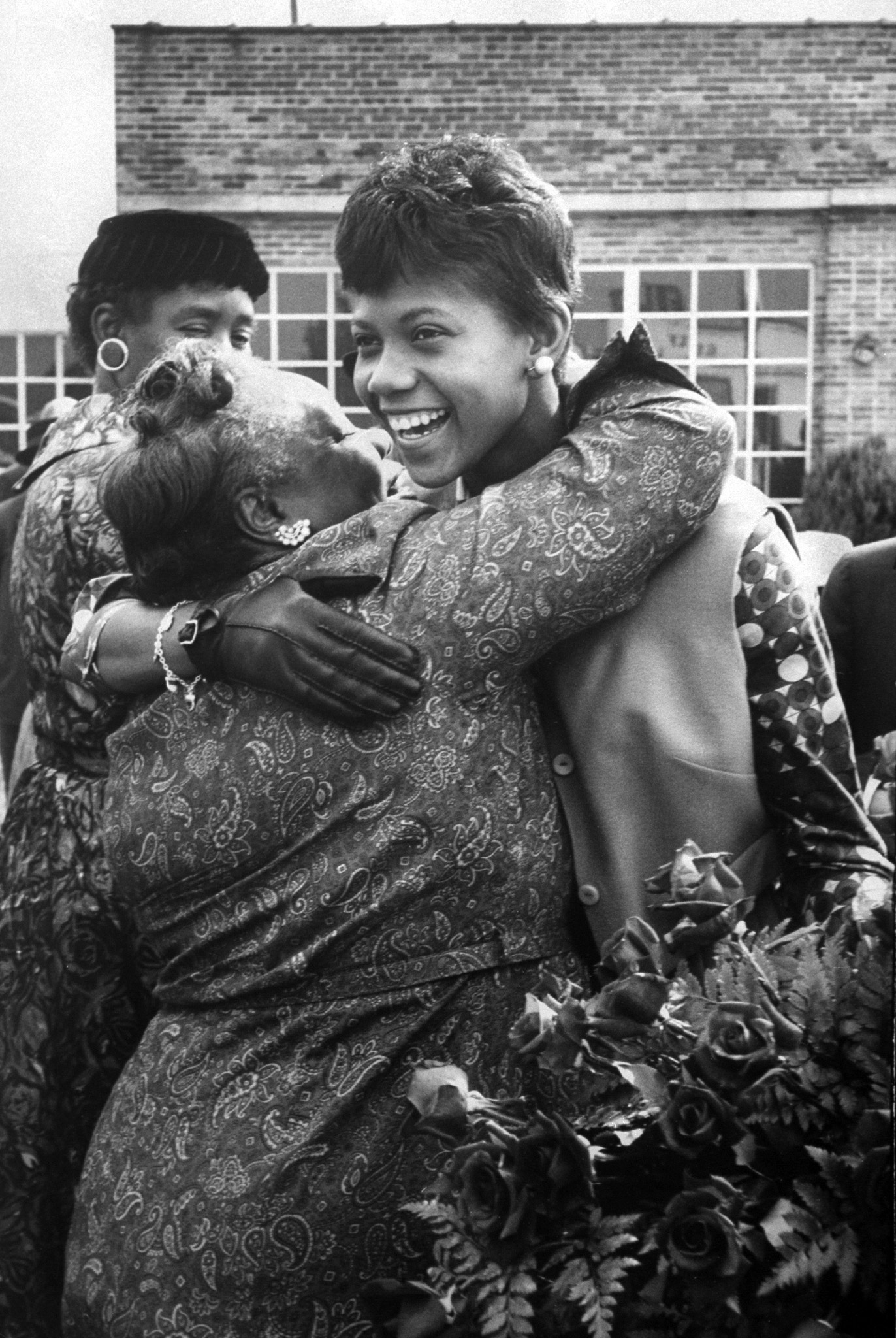 Olympic track star Wilma Rudolph hugging her grade-school teacher, 1960.
