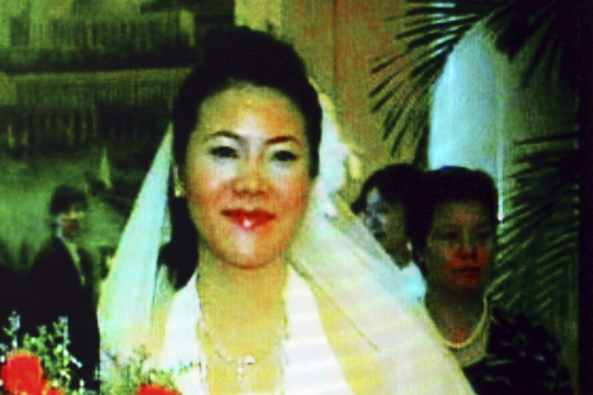 Video screen shot taken on October 23, 2008 shows Yang Huiyan, right, a major shareholder of Country Garden and Chinese Mainlands richest woman, and her husband Chen Chong during their wedding ceremony in Foshan city, south Chinas Guangdong province, 2006.