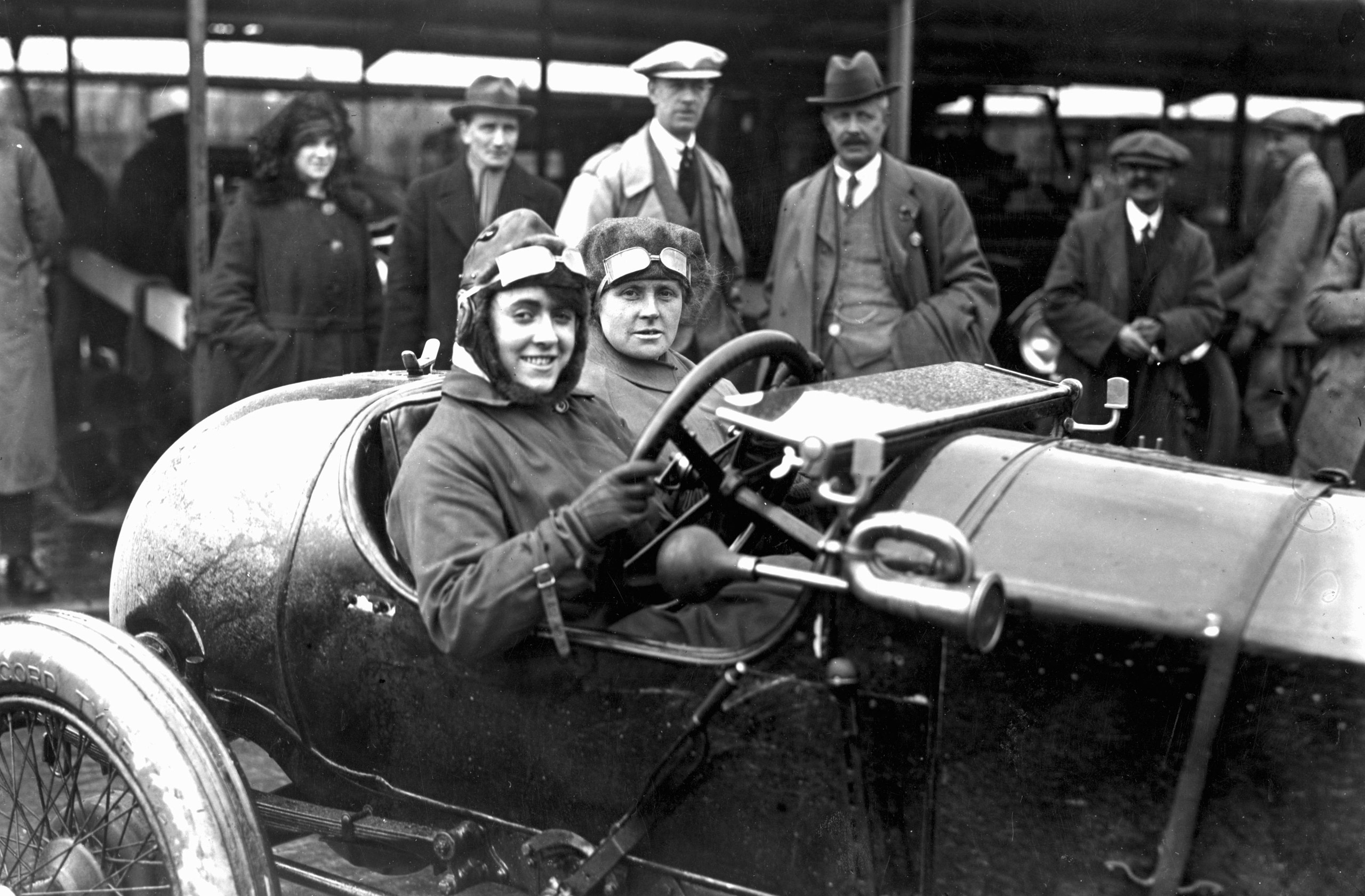 Motor meeting at Brooklands, Weybridge, Surrey. Competitor Ivy Cummings and her mother in their racing car. April 1920.