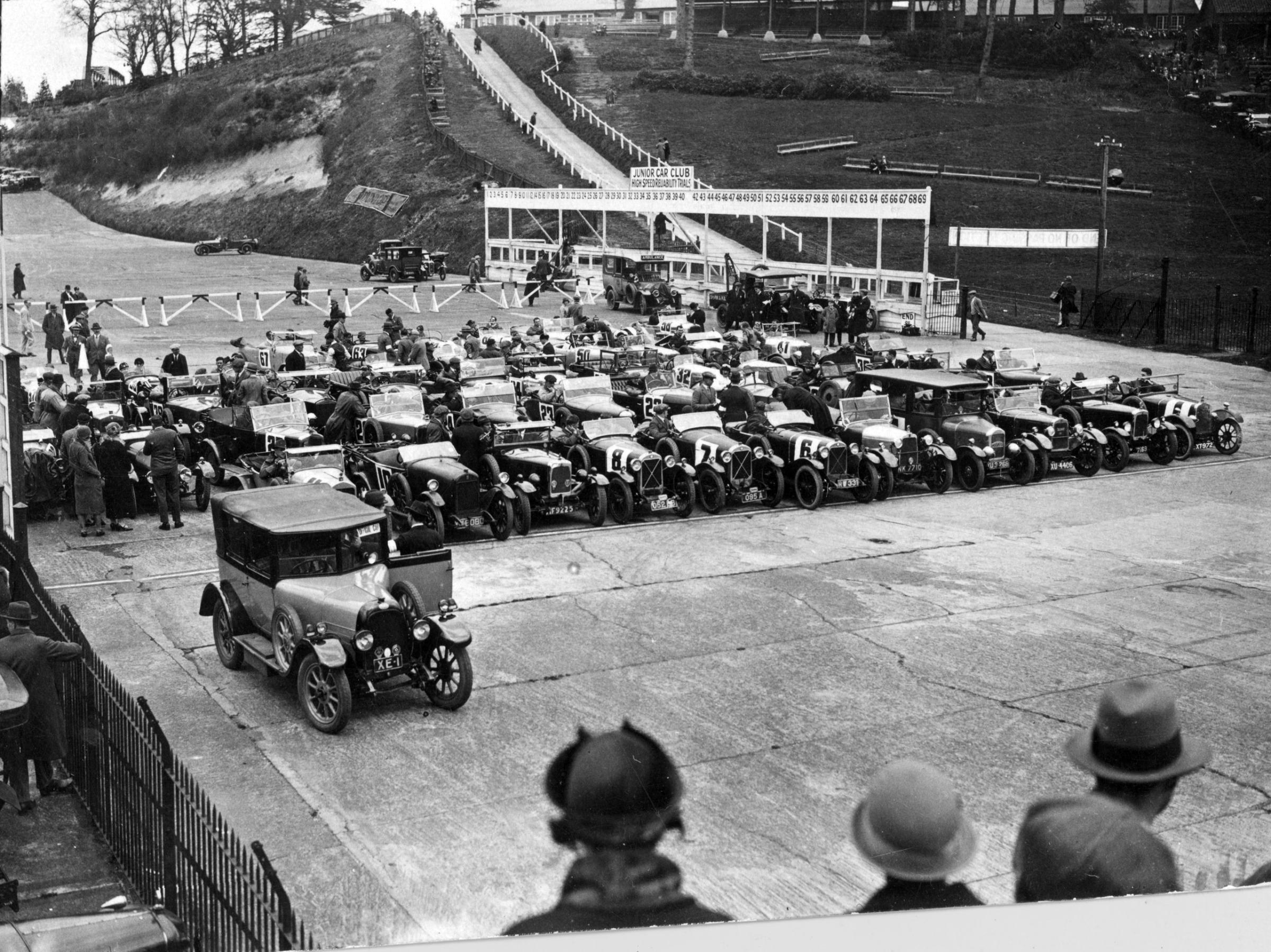 58 light cars starting the 100 miles high speed reliability trials at Brooklands, Weybridge, Surrey, England. May 1925.