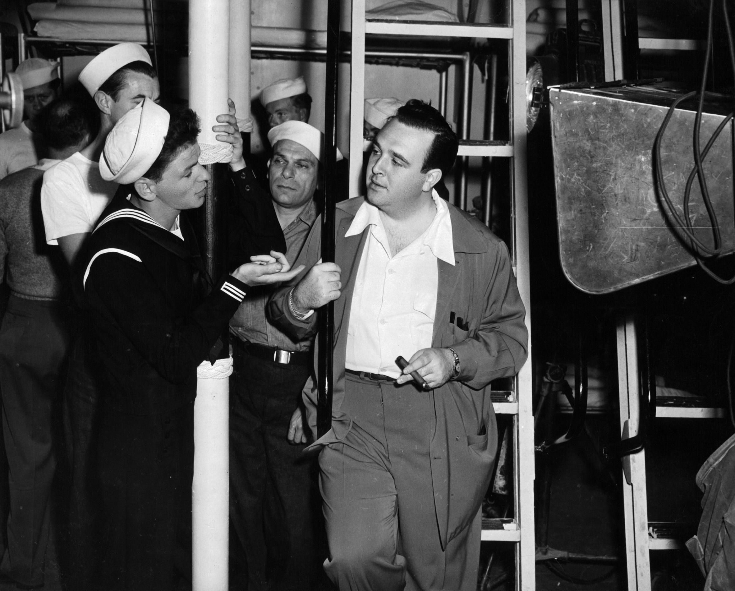 Frank Sinatra having conversation with director George Sidney in between scenes from the film 'Anchors Aweigh', 1945.