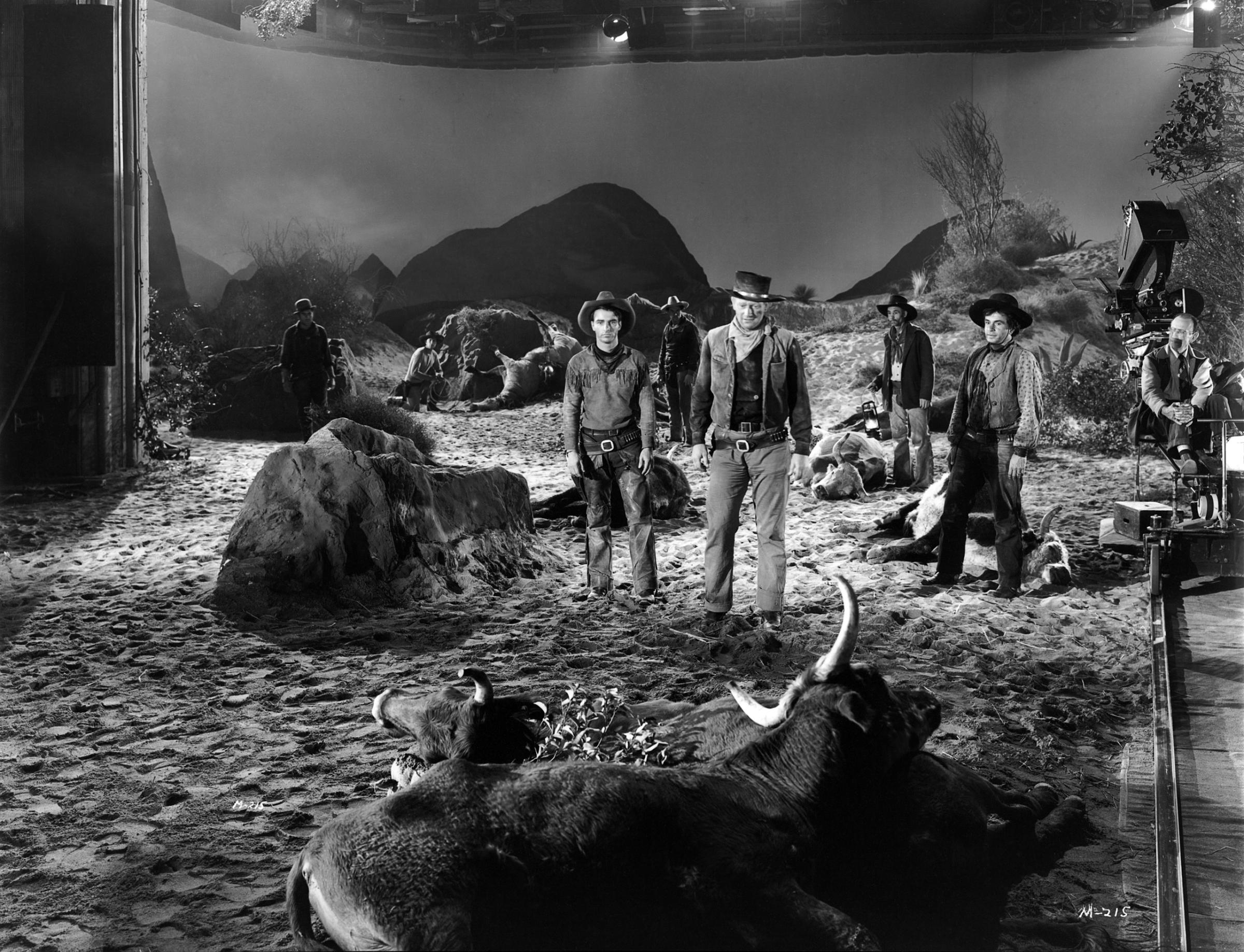 Montgomery Clift and John Wayne on the studio set of the western 'Red River', 1948.