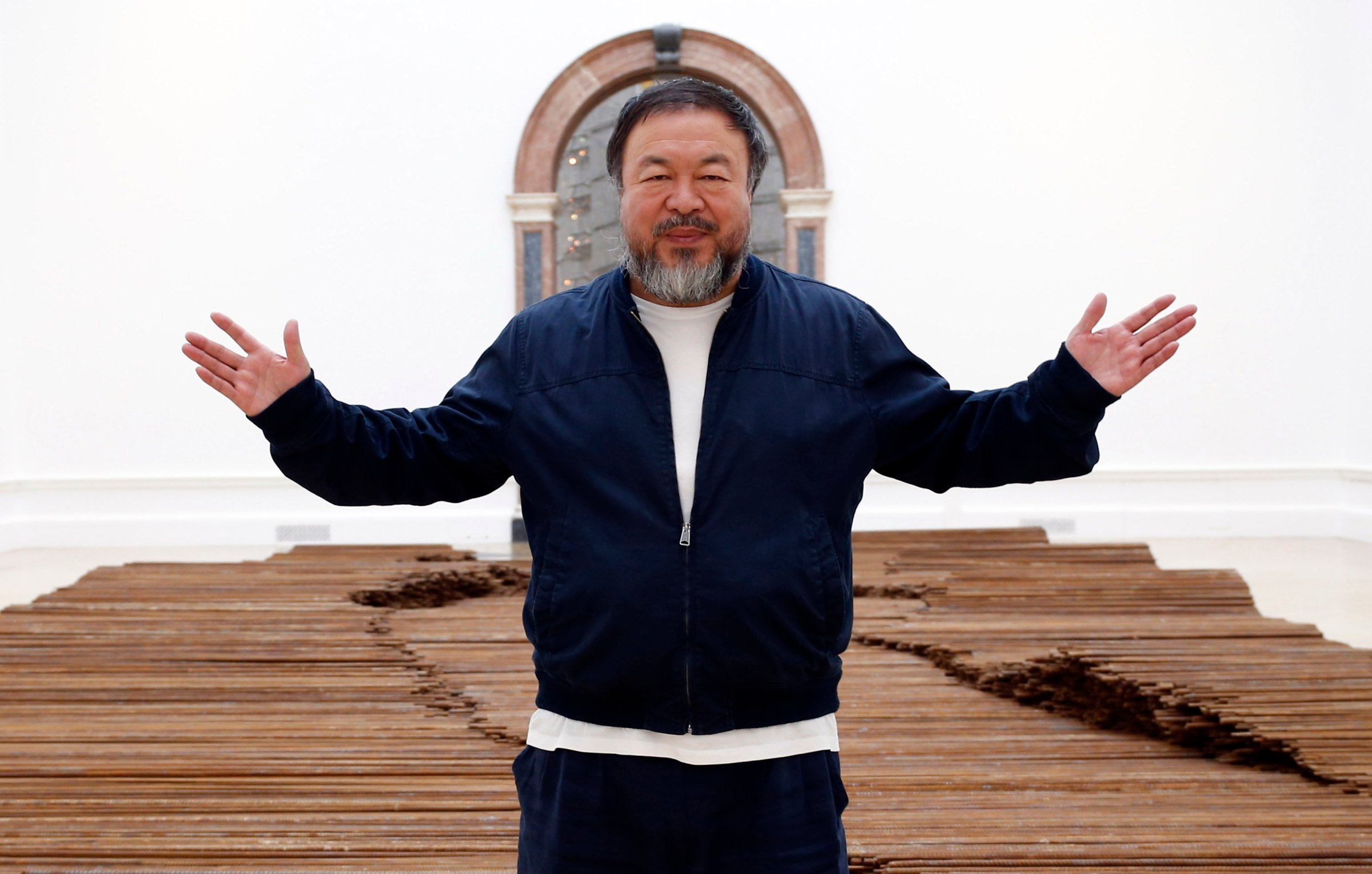 Ai Weiwei stands with his sculpture 'Straight' as he previews works from his landmark art exhibition in London on Sept. 15, 2015.