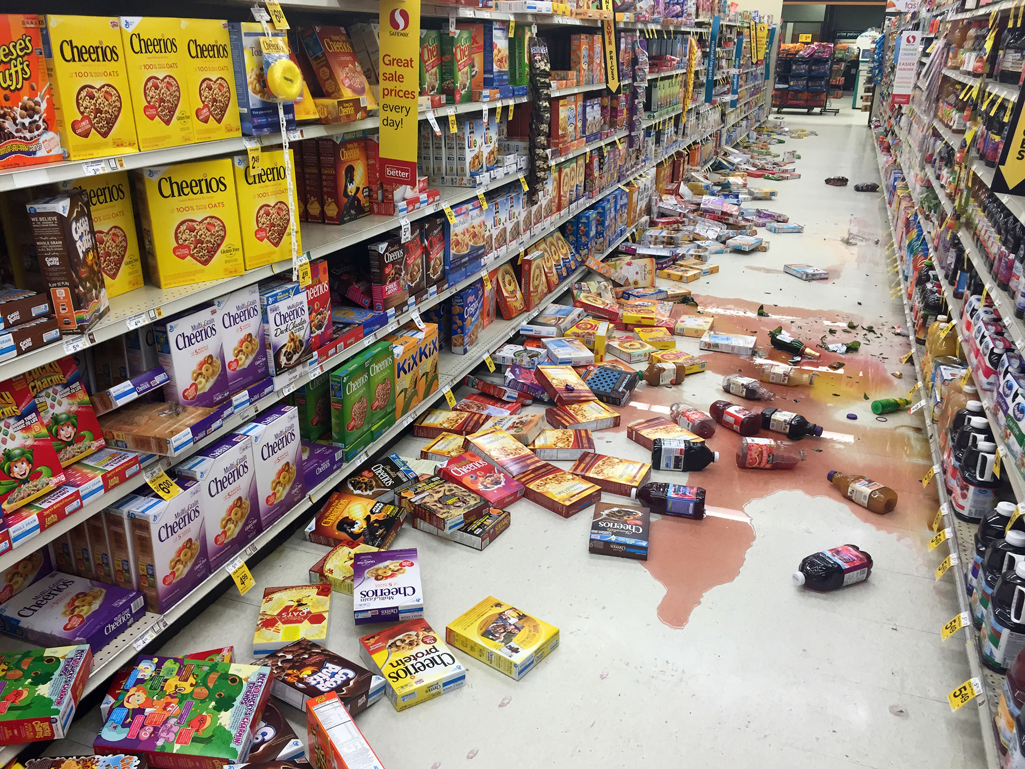 Boxes of cereal and bottles of juice lie on the floor of a Safeway grocery store following an earthquake on the Kenai Peninsula in Alaska on Jan. 24, 2016.