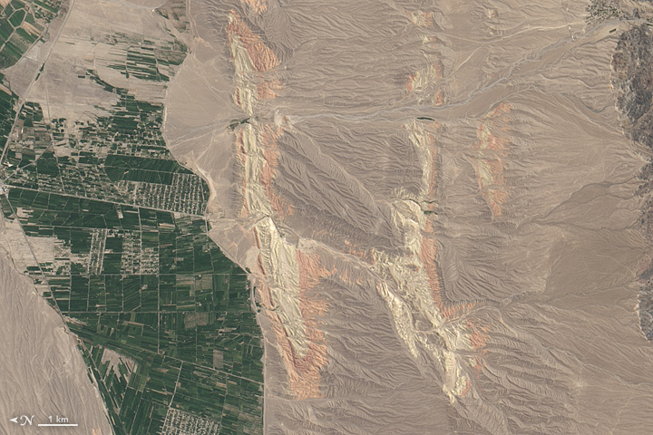The Operational Land Imager on Landsat 8 acquired this image of rivers running through colorful ridges in southwestern Kyrgyzstan on August 30, 2014.