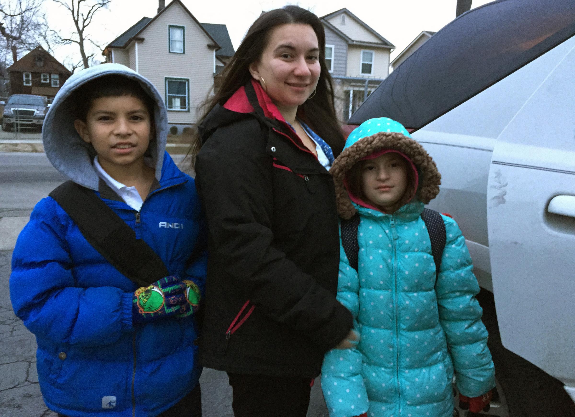 Detroit Public School teacher Alise Anaya with her children Victor, 10, and Analise, 8, before they head to a public school in Southwest Detroit from their home in a nearby suburb.