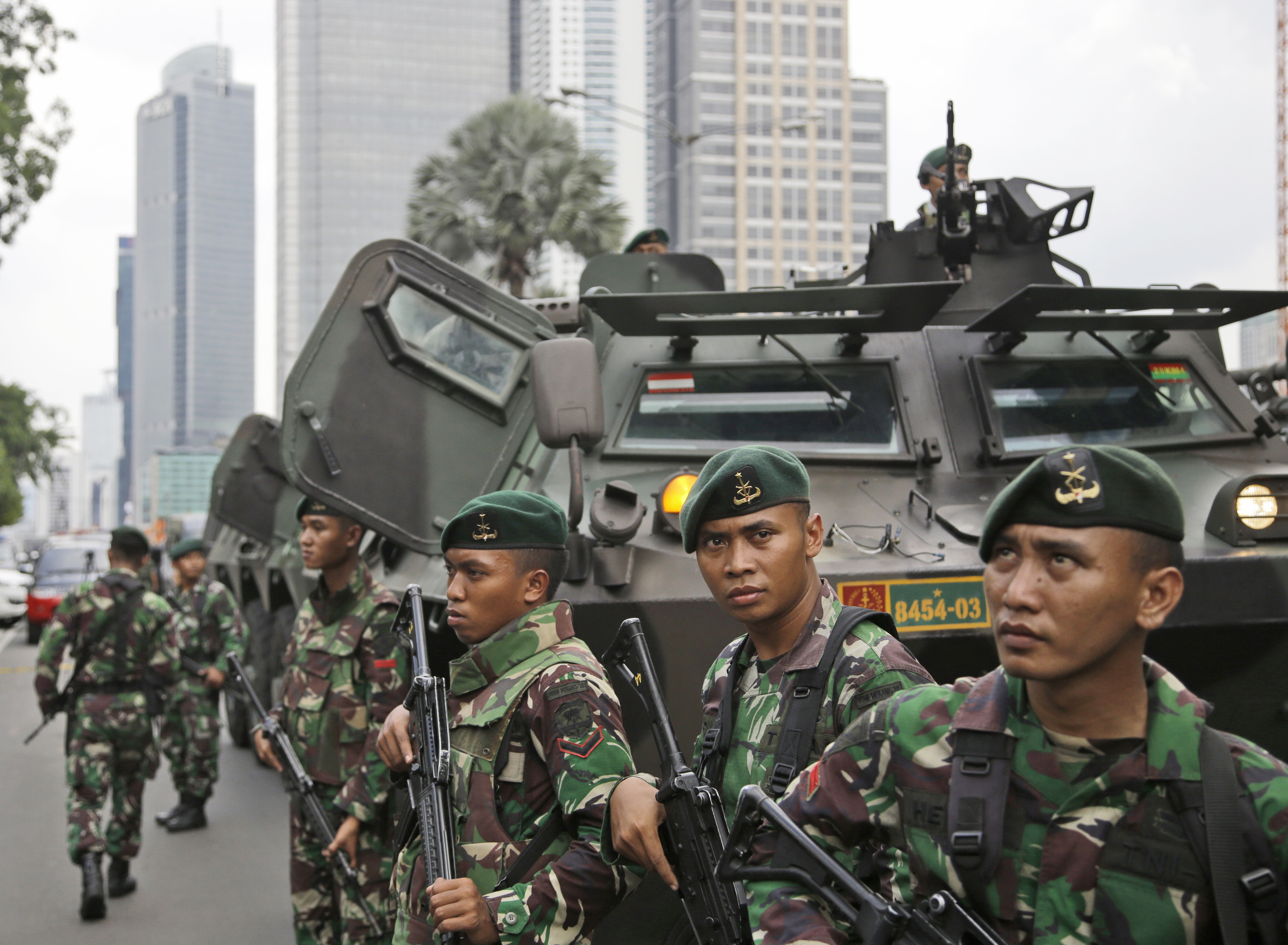 Indonesian soldiers stand guard near the site where an explosion went off in Jakarta, Indonesia, Jan. 14, 2016. (Dita Alangkara—AP)
