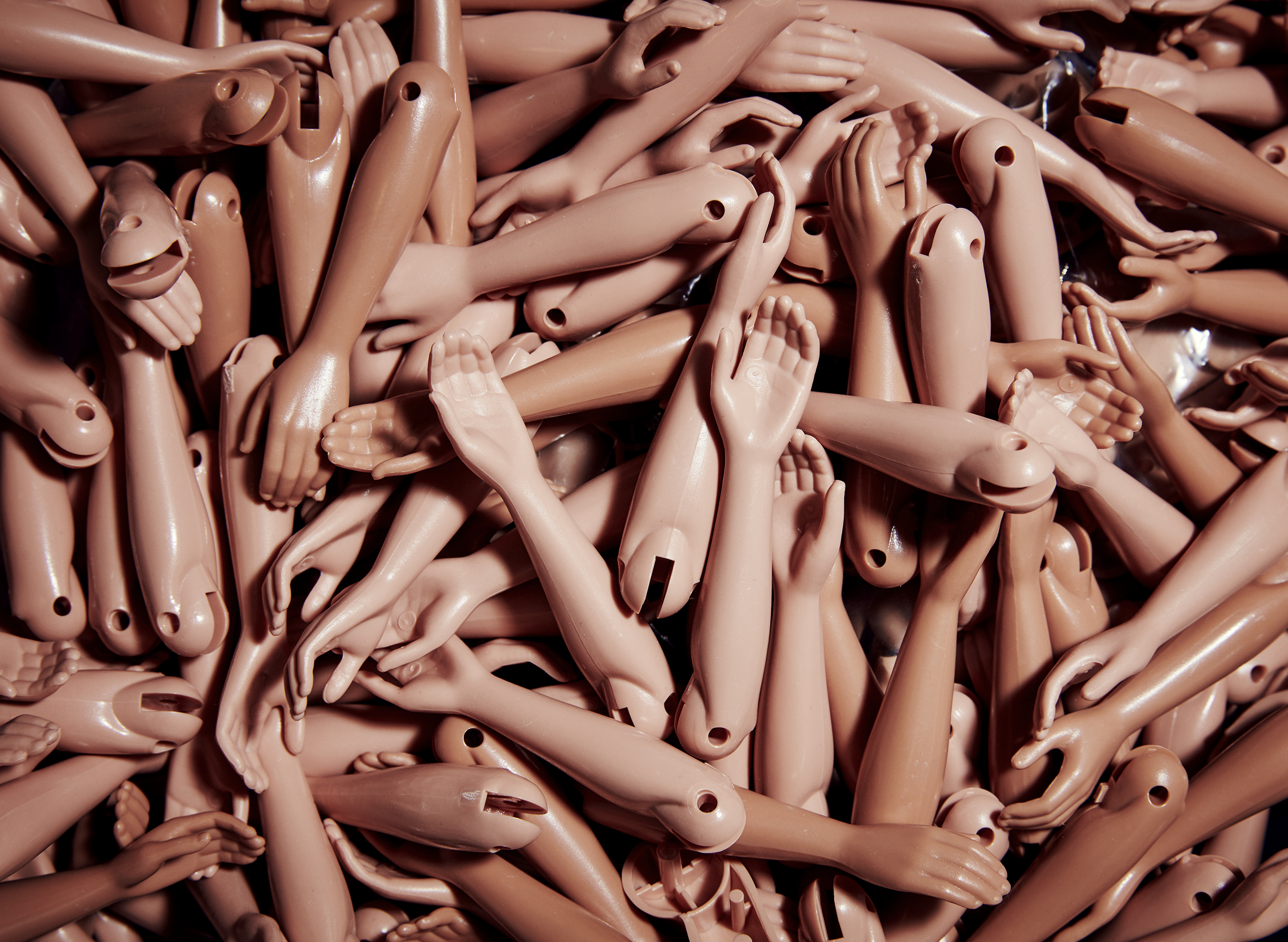 Barbie's forearms all together in a container at Mattel's El Segundo, Calif. headquarters.
