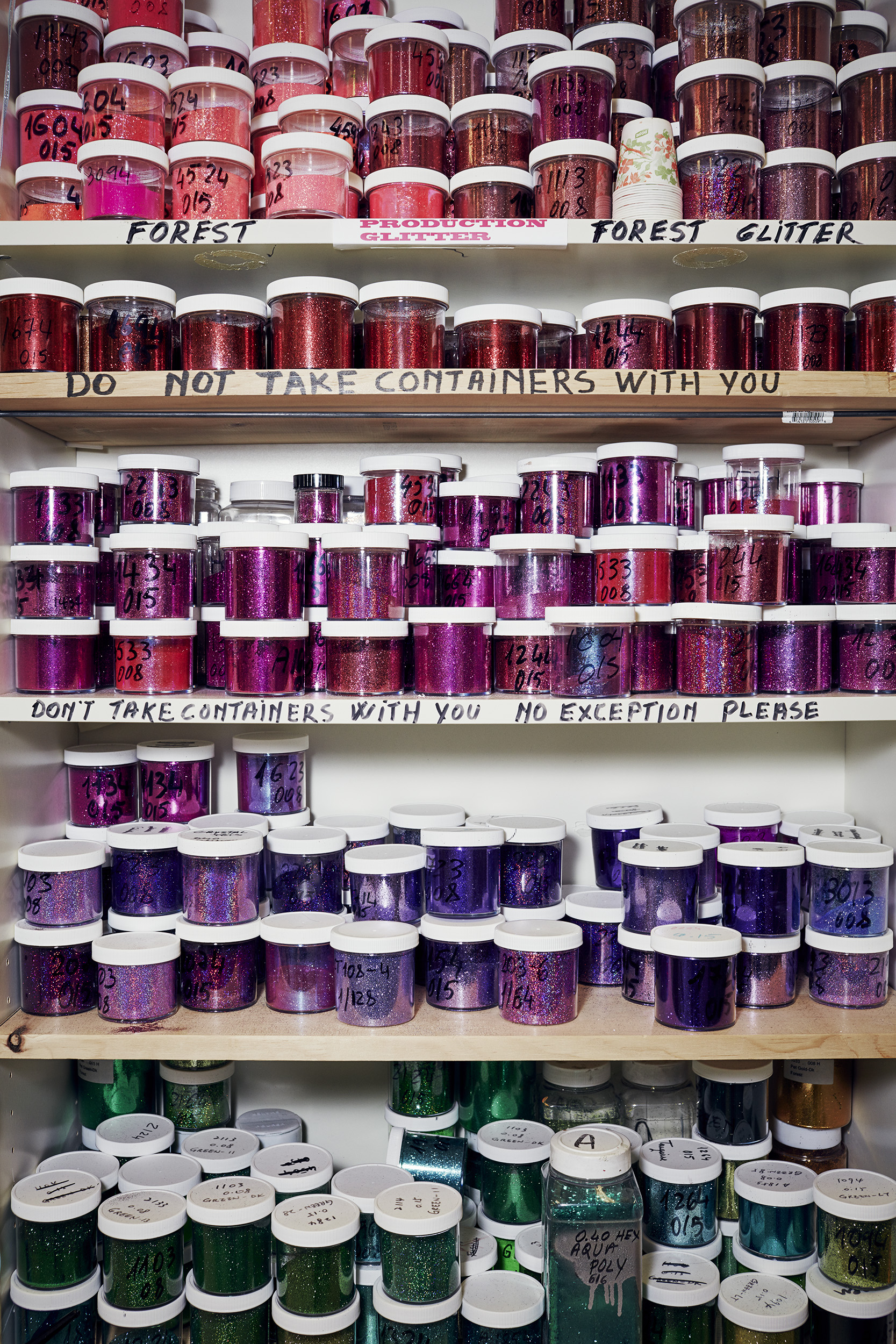Dozens of colorful containers of glitter await use in the design center at Mattel's headquarters.