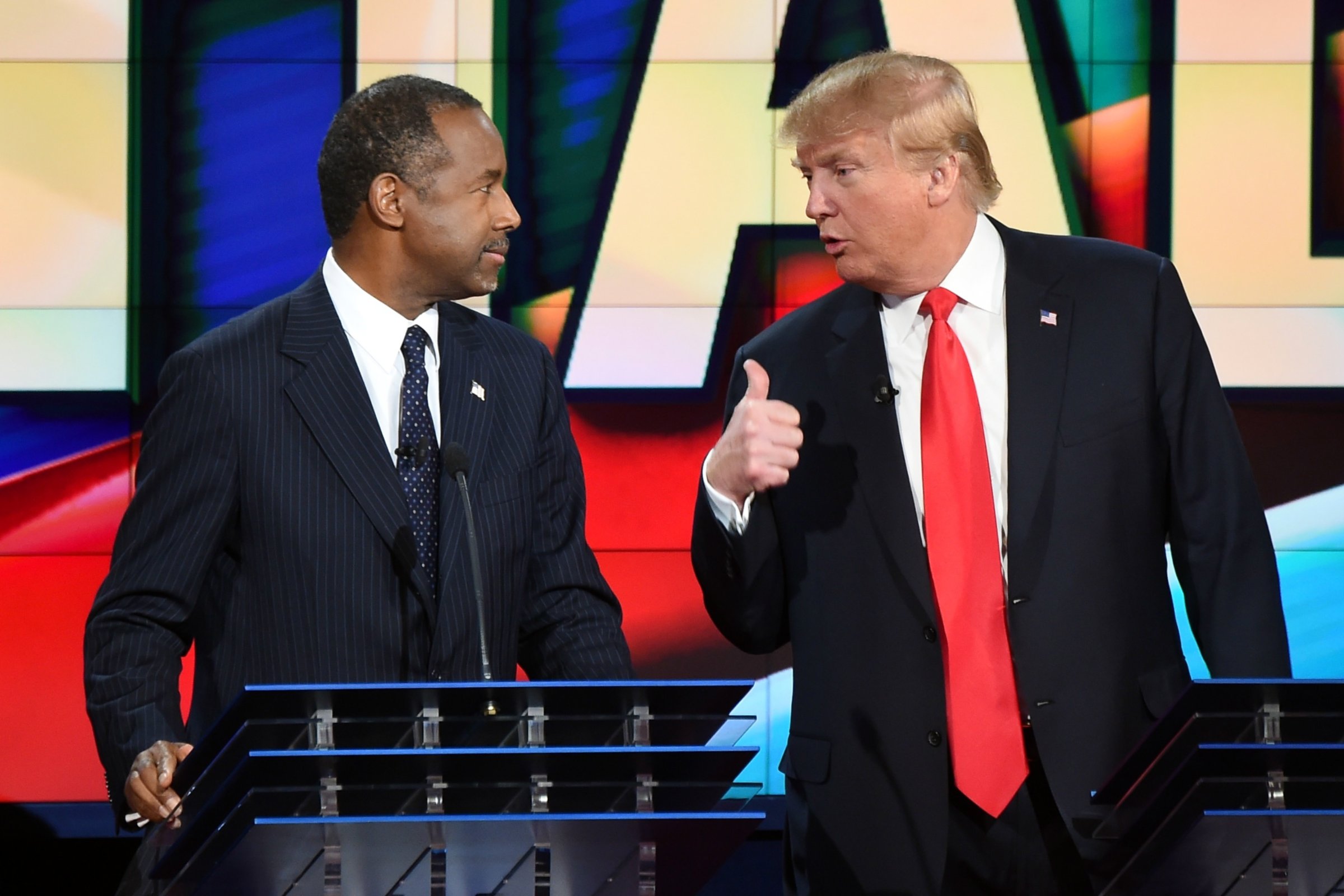 Republican presidential candidates Ben Carson, left and Donald Trump speak at a Republican presidential debate in Las Vegas in December.