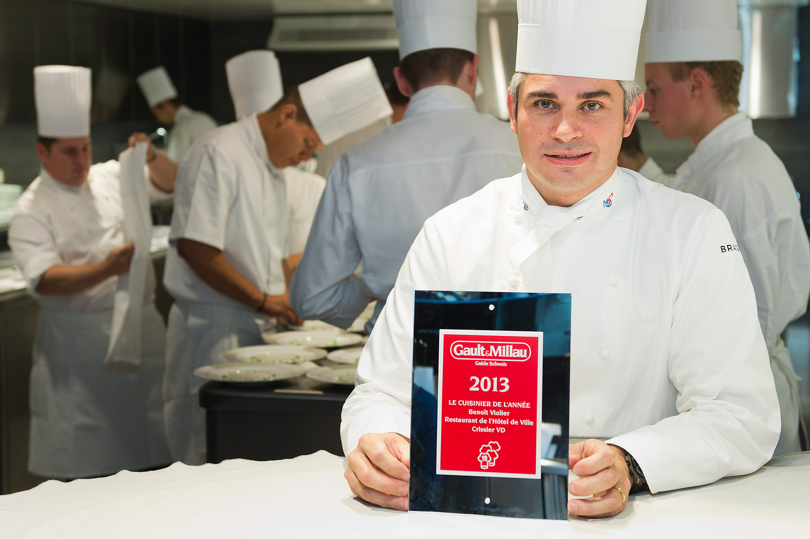 Benoit Violier poses with the certificate as Chef of the Year in his kitchen in the Hotel de Ville in Crissier, Switzerland, Oct. 8, 2012. (Jean-Christophe Bott—Keystone/AP)