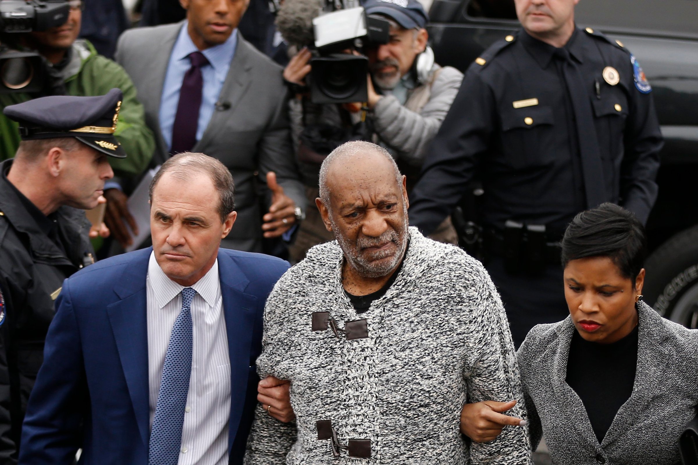 Bill Cosby accompanied by his attorneys Brian McMonagle and Monique Pressley, arrive at court to face a felony charge of aggravated indecent assault, in Elkins Park, Pa. on Dec. 30, 2015.