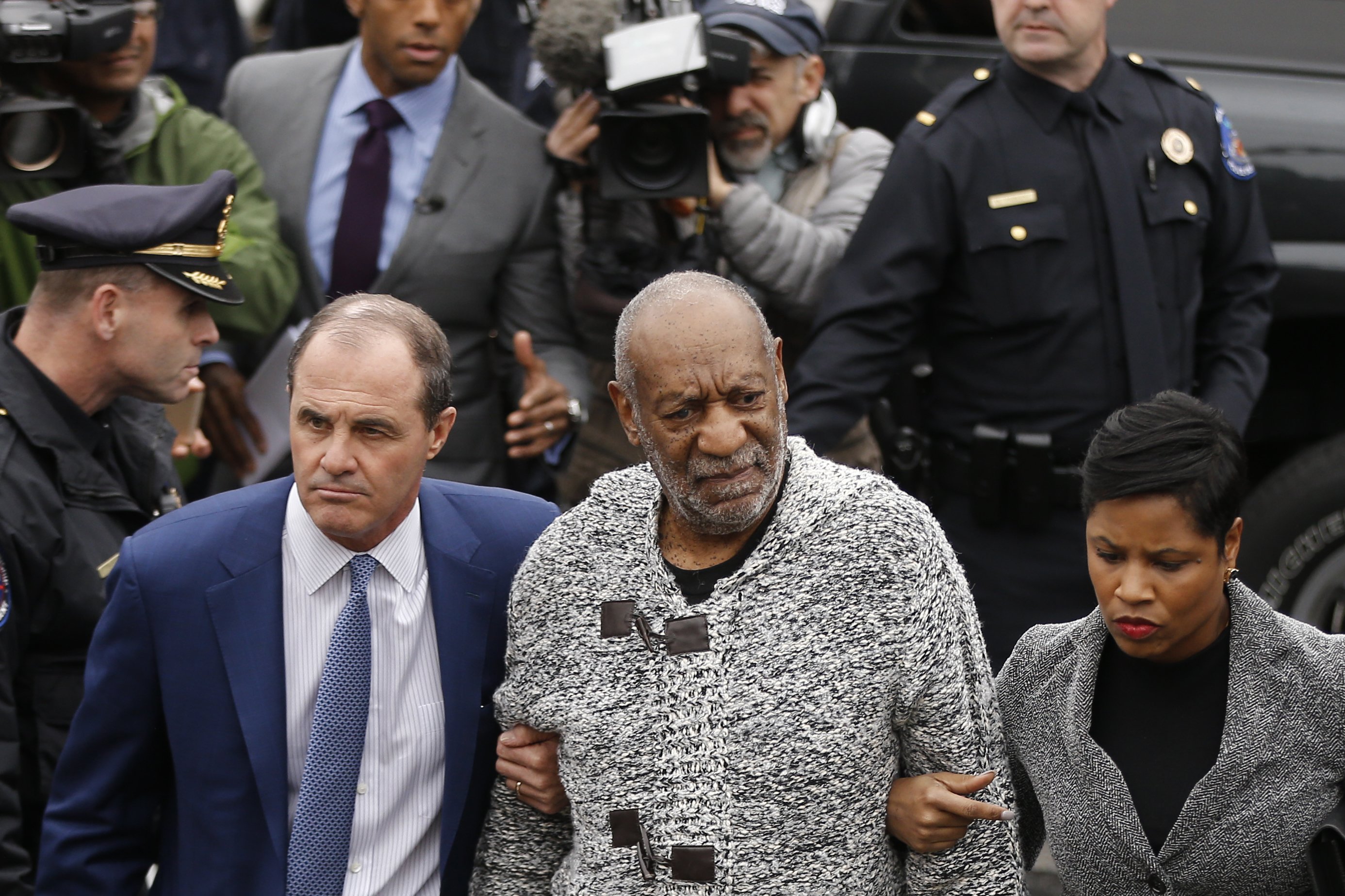 Bill Cosby, accompanied by his attorneys Brian McMonagle and Monique Pressley, arrives at court to face a felony charge of aggravated indecent assault in Elkins Park, Pa., on Dec. 30, 2015. (Matt Rourke—AP)