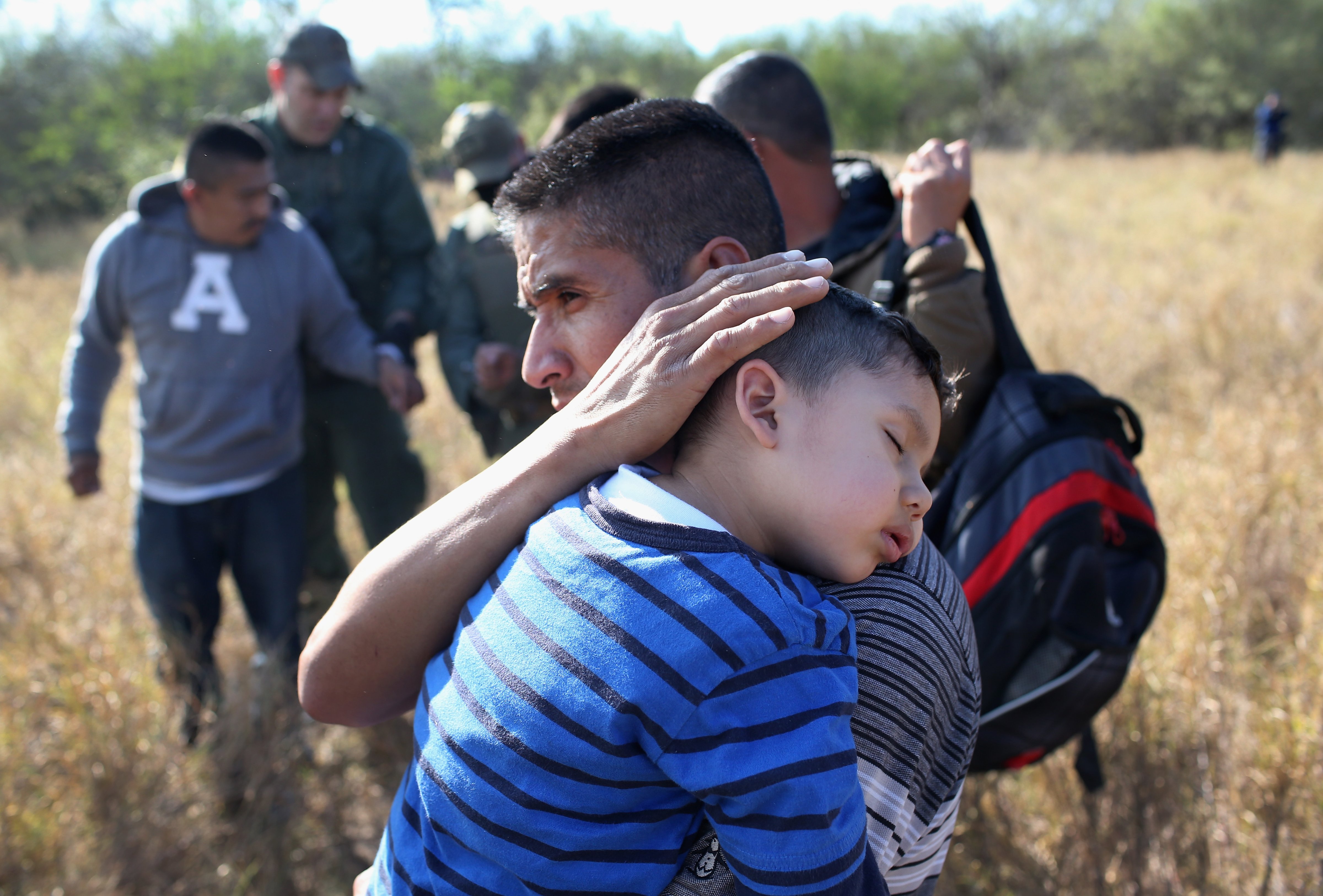 A father and his son after being detained by Border Patrol agents on Dec. 7, 2015 near Rio Grande City, Texas. (John Moore&mdash;Getty Images)