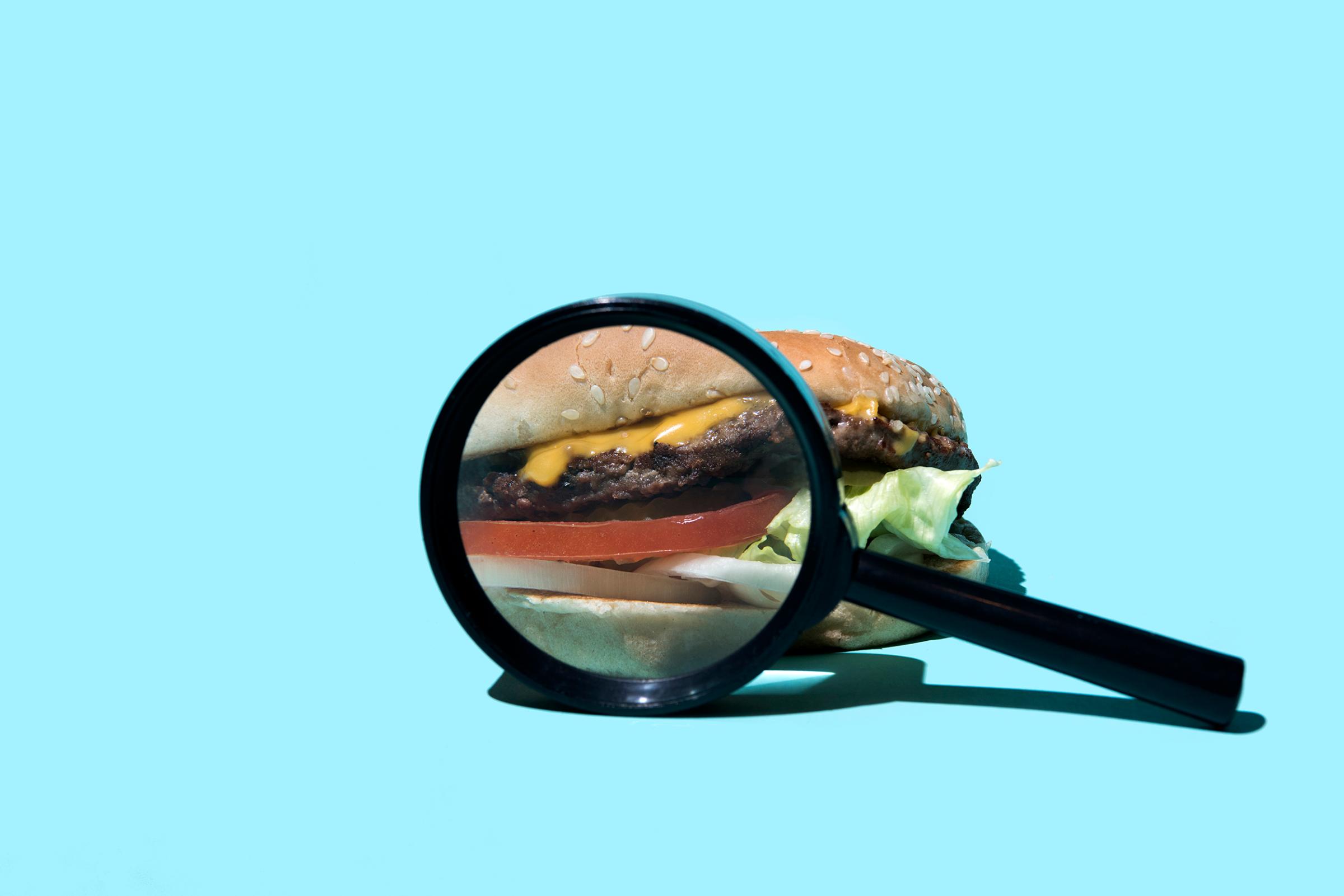 burger-magnified-diet-junk-food-health-motto-stock