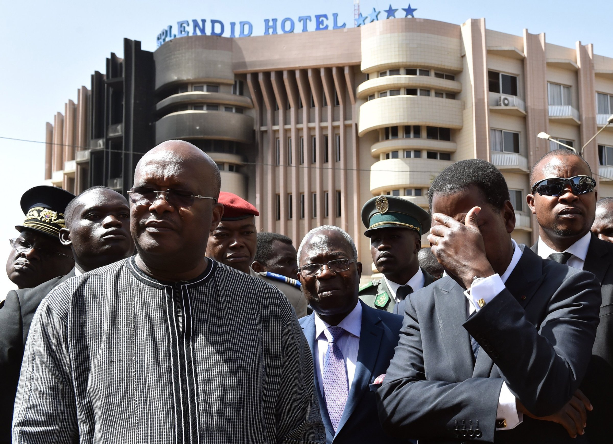 Burkina Faso's President Roch Marc Christian Kabore (L) and Benin's President Thomas Boni Yayi (R) visit the Splendid hotel and the Capuccino cafe on January 18, 2016 in Ouagadougou, following a jihadist attack by Al-Qaeda in the Islamic Maghreb (AQIM) late on January 15. West African nations will "fight back" after a Burkina Faso hotel attack that left 29 dead and showed jihadist fighters expanding their reach in the region, Benin President Thomas Boni Yayi said on January 18, 2016. Friday's attack on a four-star hotel, which left at least 29 dead, half of them foreigners, came weeks after an attack on a luxury Mali hotel in Bamako claimed by Islamists that left 20 people dead. / AFP / ISSOUF SANOGOISSOUF SANOGO/AFP/Getty Images