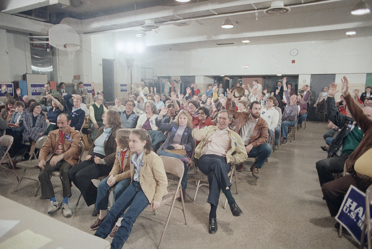 Hands go up to vote for former Vice President Walter Mondale Feb. 20, 1984, at a Democratic Precinct Caucus at St. Anthony's Church School in Des  Moines. (Charles Bennett—AP)