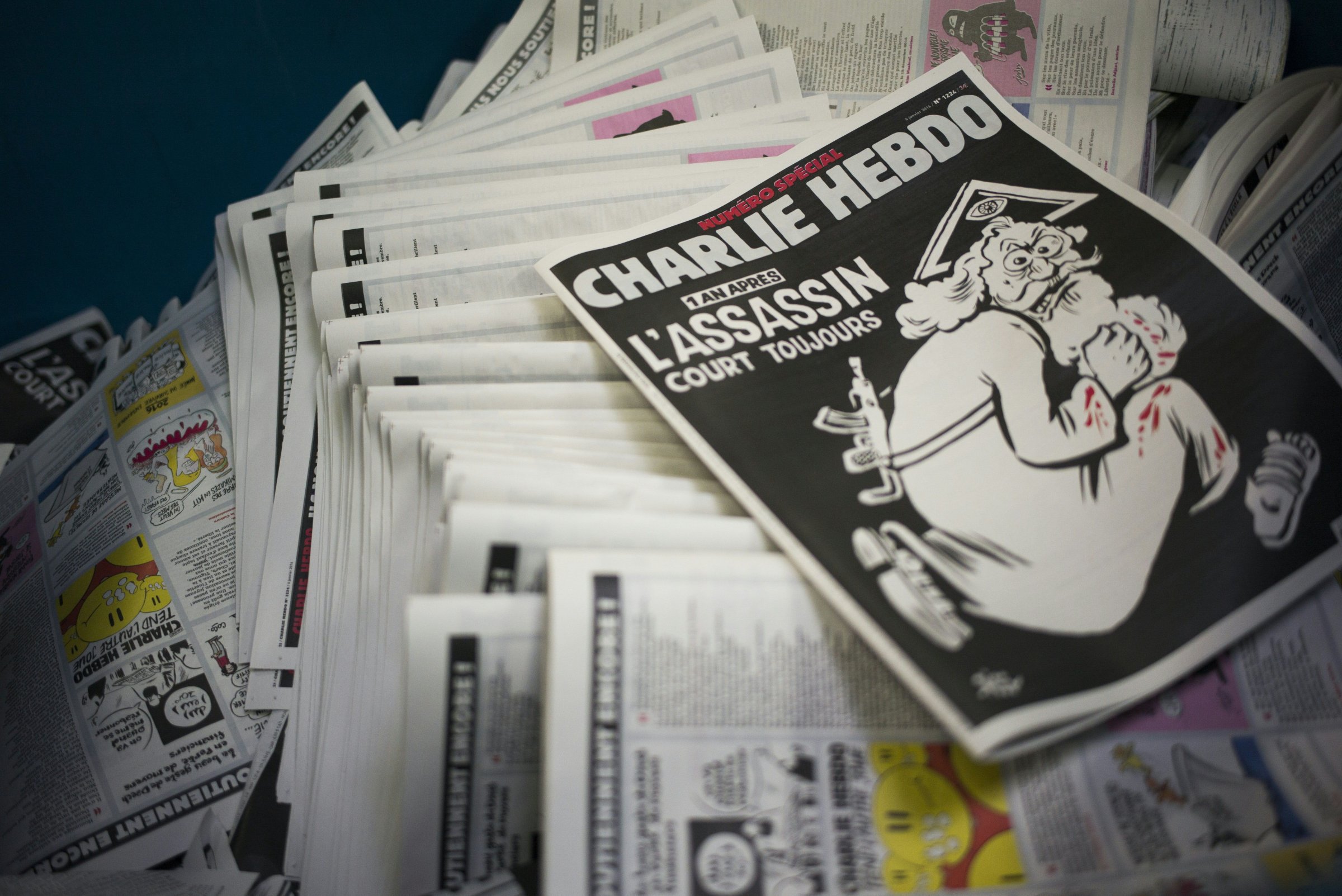 The latest edition of Charlie Hebdo is seen at a printing house near Paris on Jan. 4, 2016.