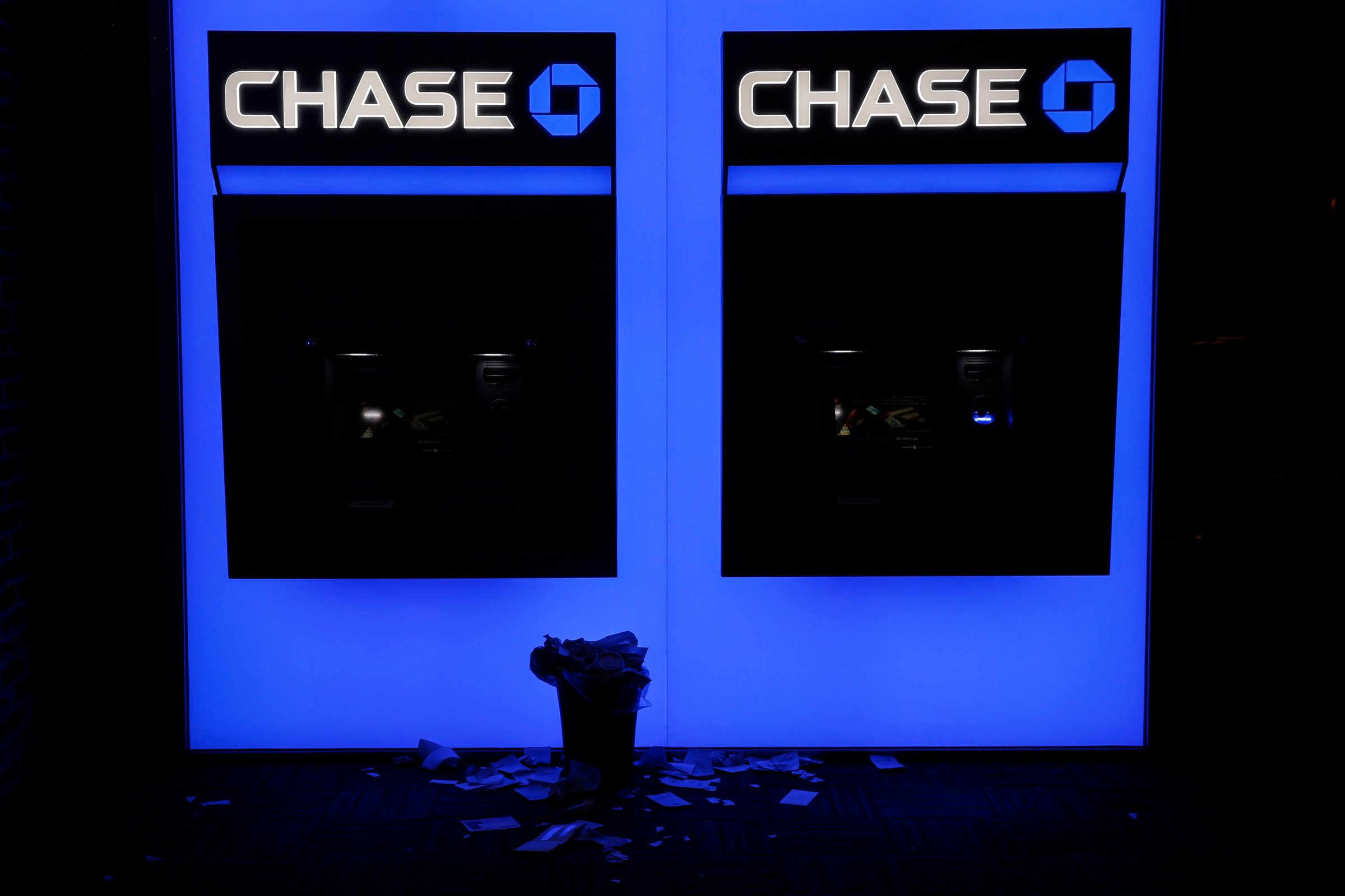 Receipts rest beneath JPMorgan Chase &amp; Co. bank ATMs in San Diego, California, U.S., on Wednesday, July 8, 2015.