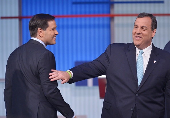 New Jersey Governor Chris Christie (R) chats with Florida Senator Marco Rubio (L) following the prime time Republican presidential debate on August 6, 2015 at the Quicken Loans Arena in Cleveland, Ohio.