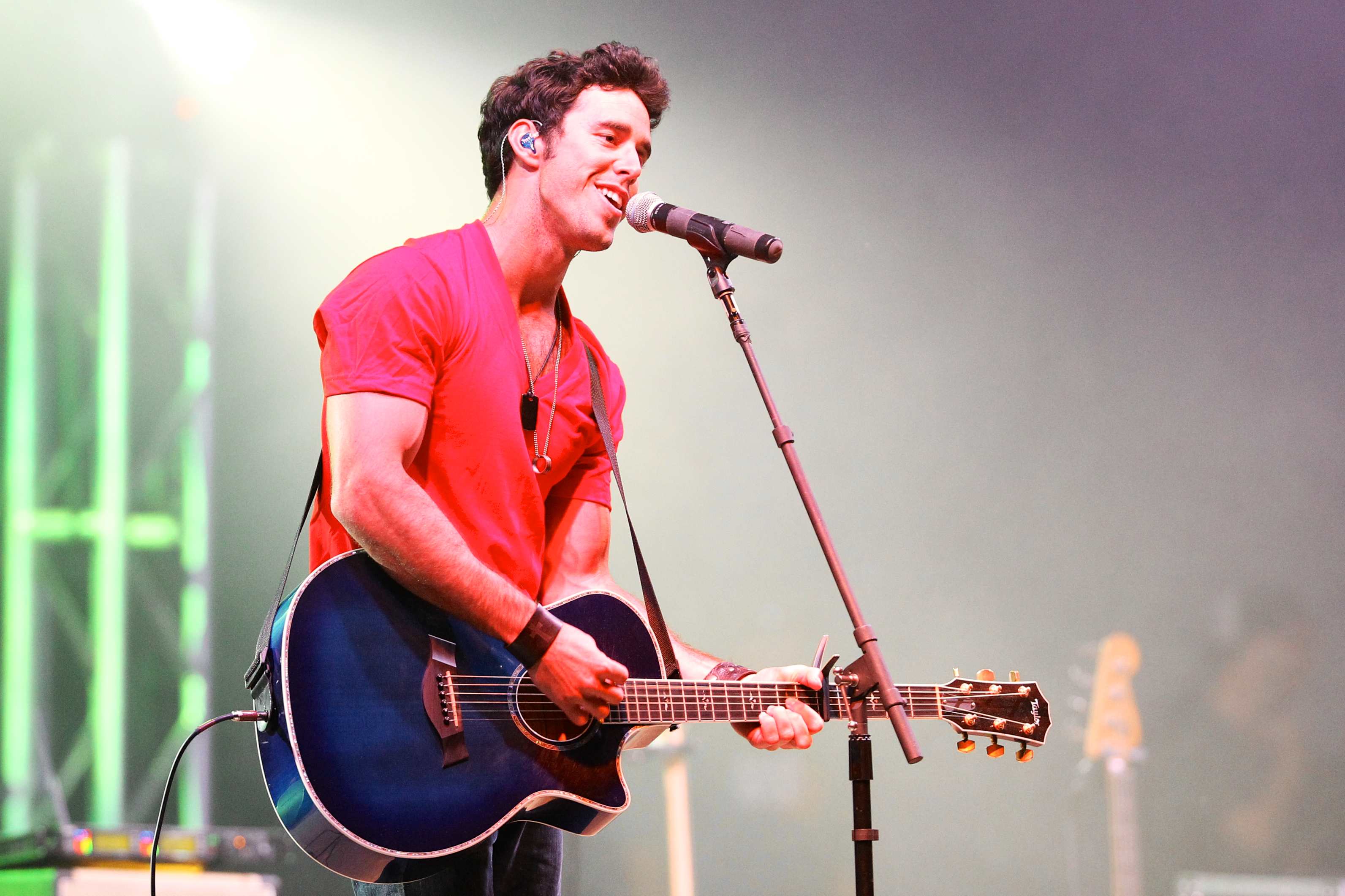 Craig Strickland of Backroad Anthem entertains the fans late into the night in Ozark, Arkansas on June 7, 2013. (Richey Miller—AP)