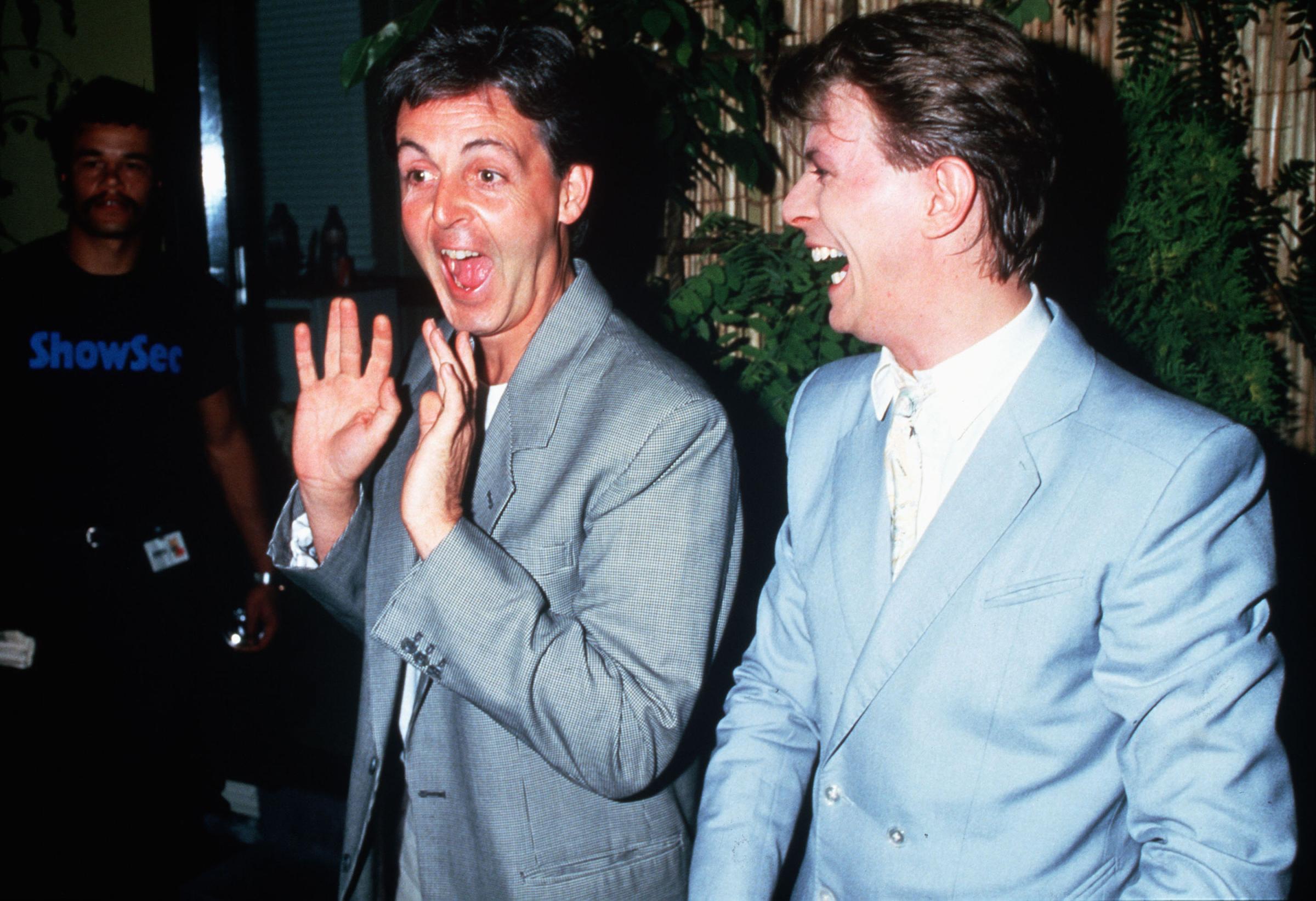 Paul McCartney and David Bowie backstage at Live Aid on July 13, 1985 in London.