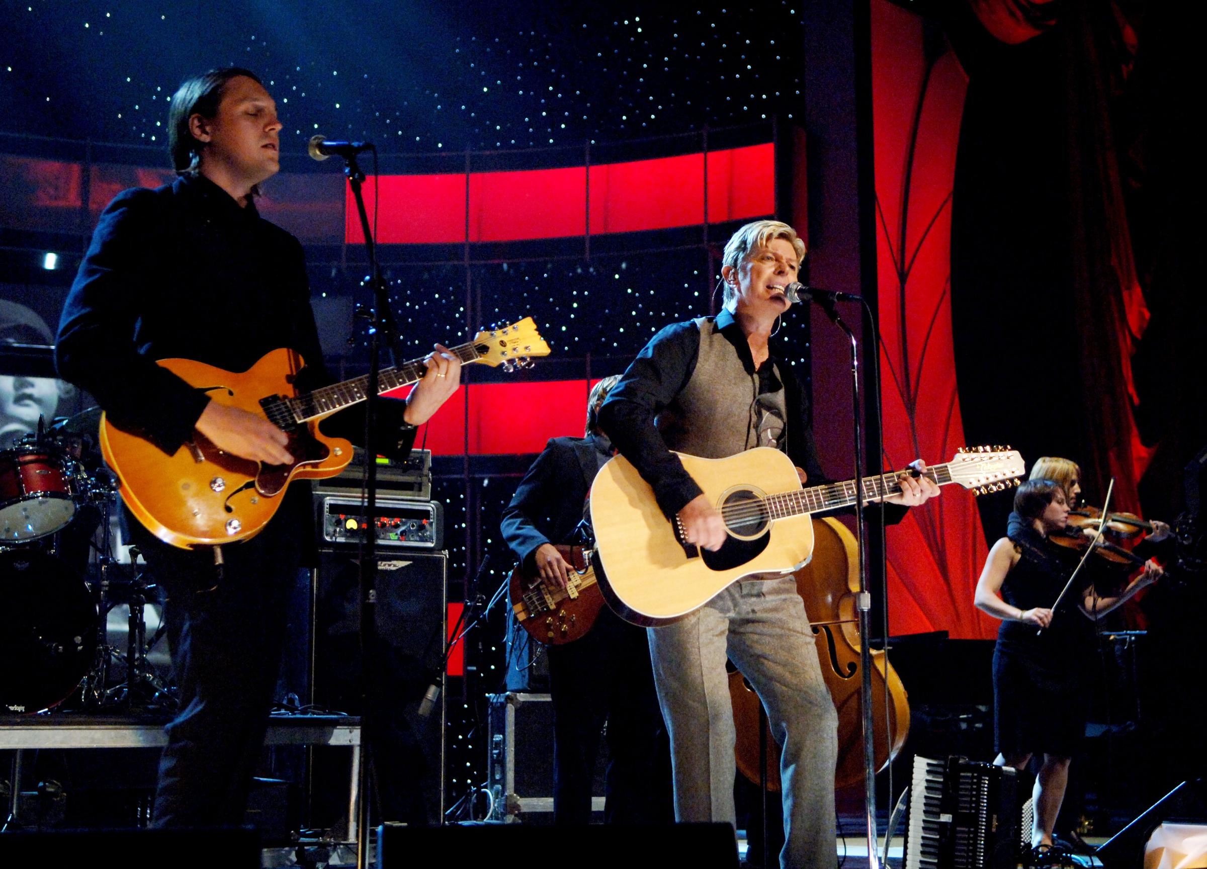 David Bowie performs with Arcade Fire at Conde Nast's 2005 Fashion Rocks Show on Sept. 8, 2005 in New York City.