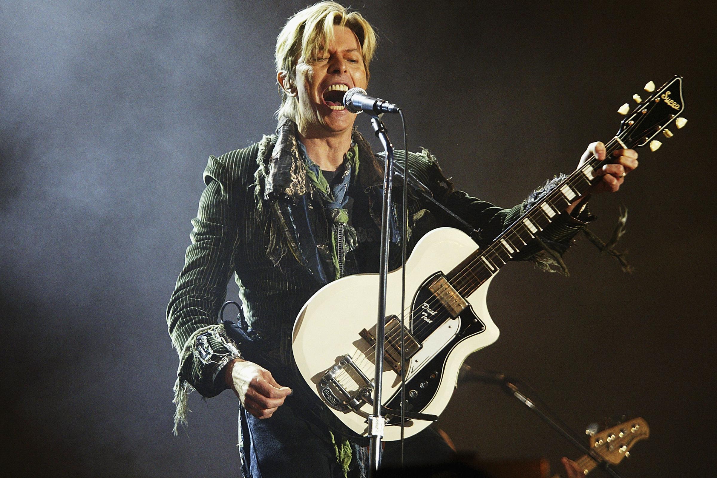 David Bowie performs during the Isle of Wight Festival at Seaclose Park on June 13, 2004 in Newport, U.K.