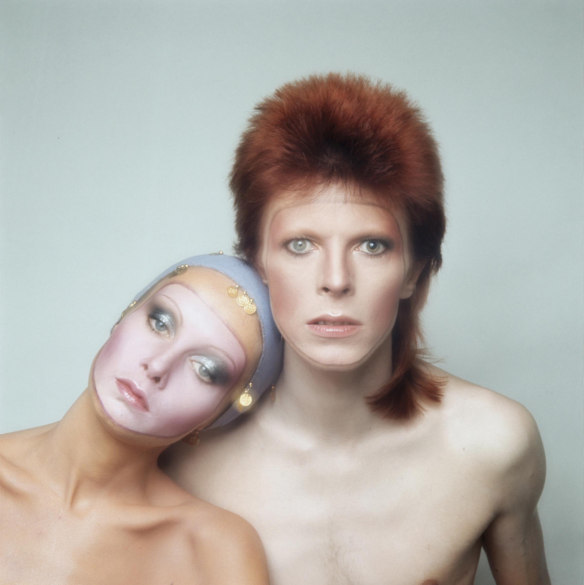 Twiggy poses with David Bowie for the cover of his Pin Ups album in 1973 in Paris.