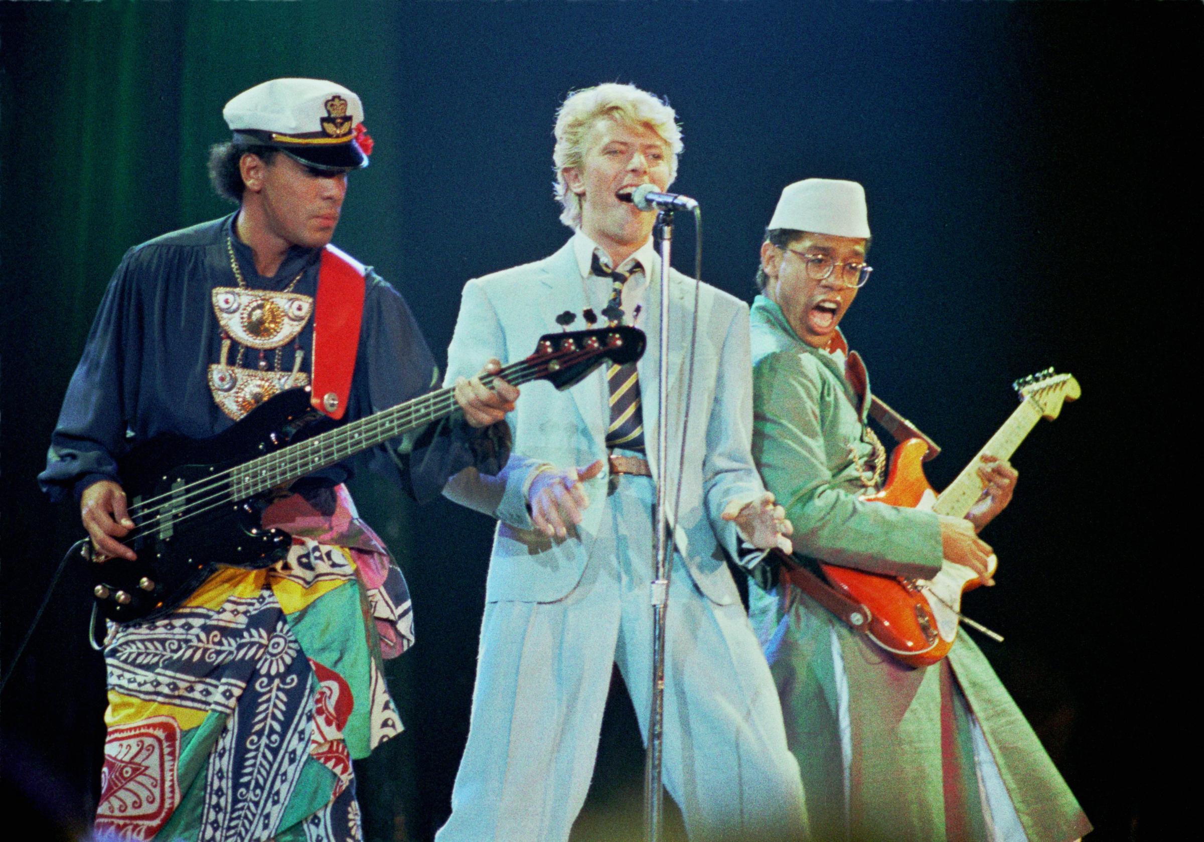 From left: Carmine Rojas, David Bowie, and Carlos Alomar perform during the Serious Moonlight tour in 1983 at Wembley Arena in London.