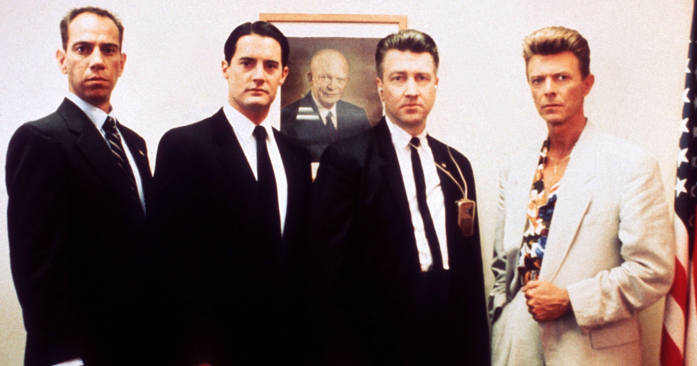 From left: Miguel Ferrer, Kyle MacLachlan, David Lynch, and David Bowie on the set of Twin Peaks: Fire Walk with Me in 1991.